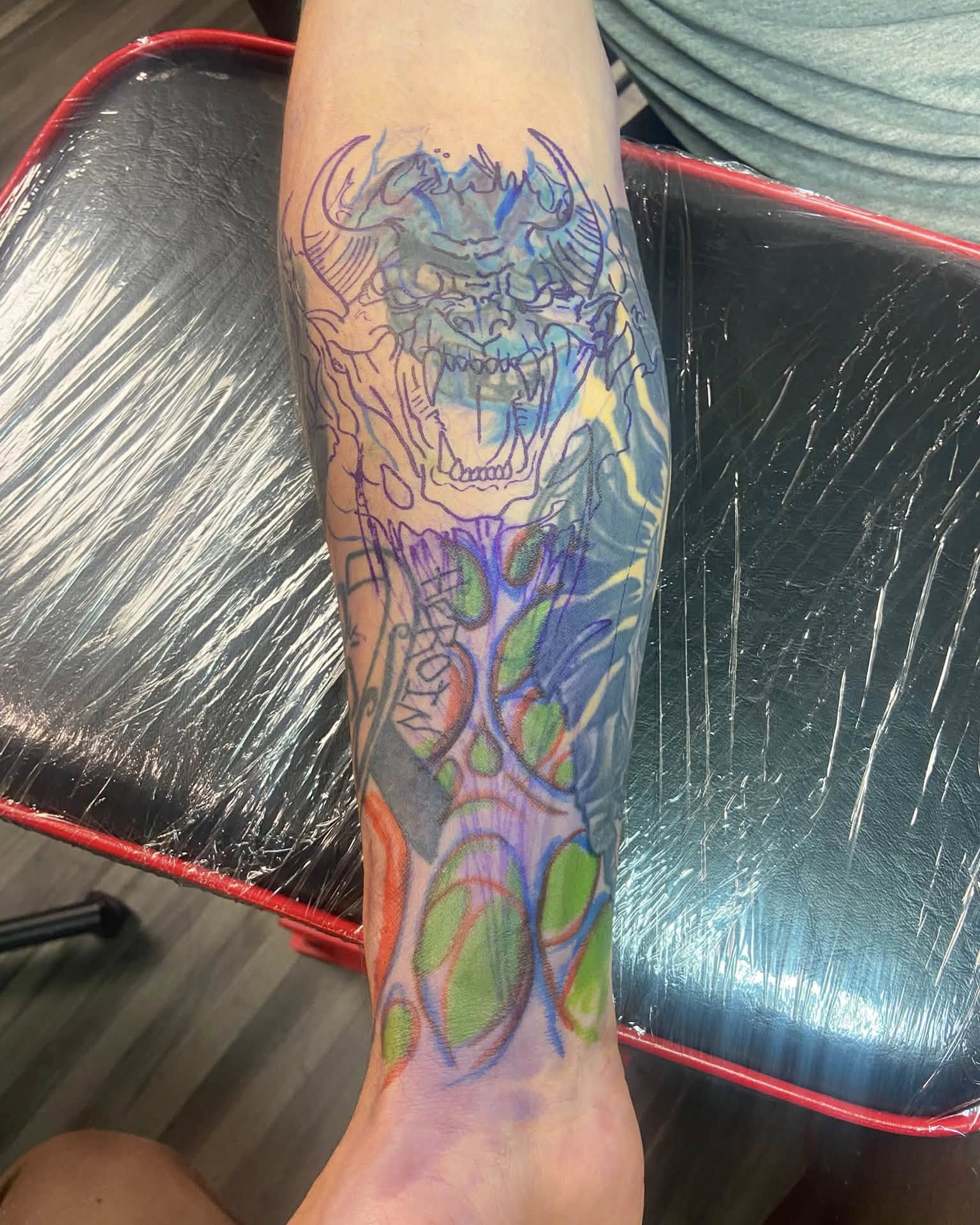 Demon neo-traditional tattoo on the calf by Mike Berry