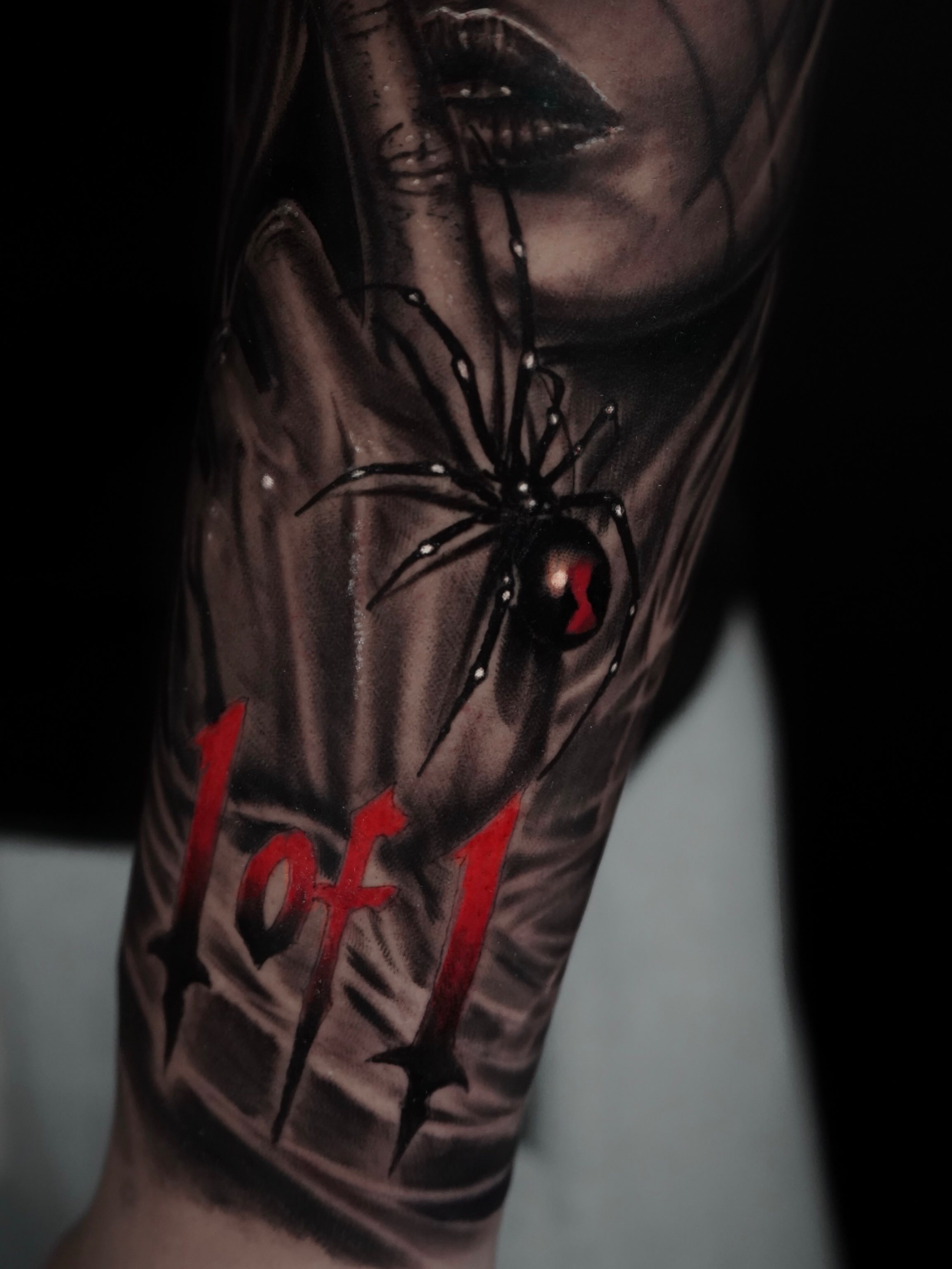 Woman with spider realism tattoo on the forearm by Carlos Trujillo