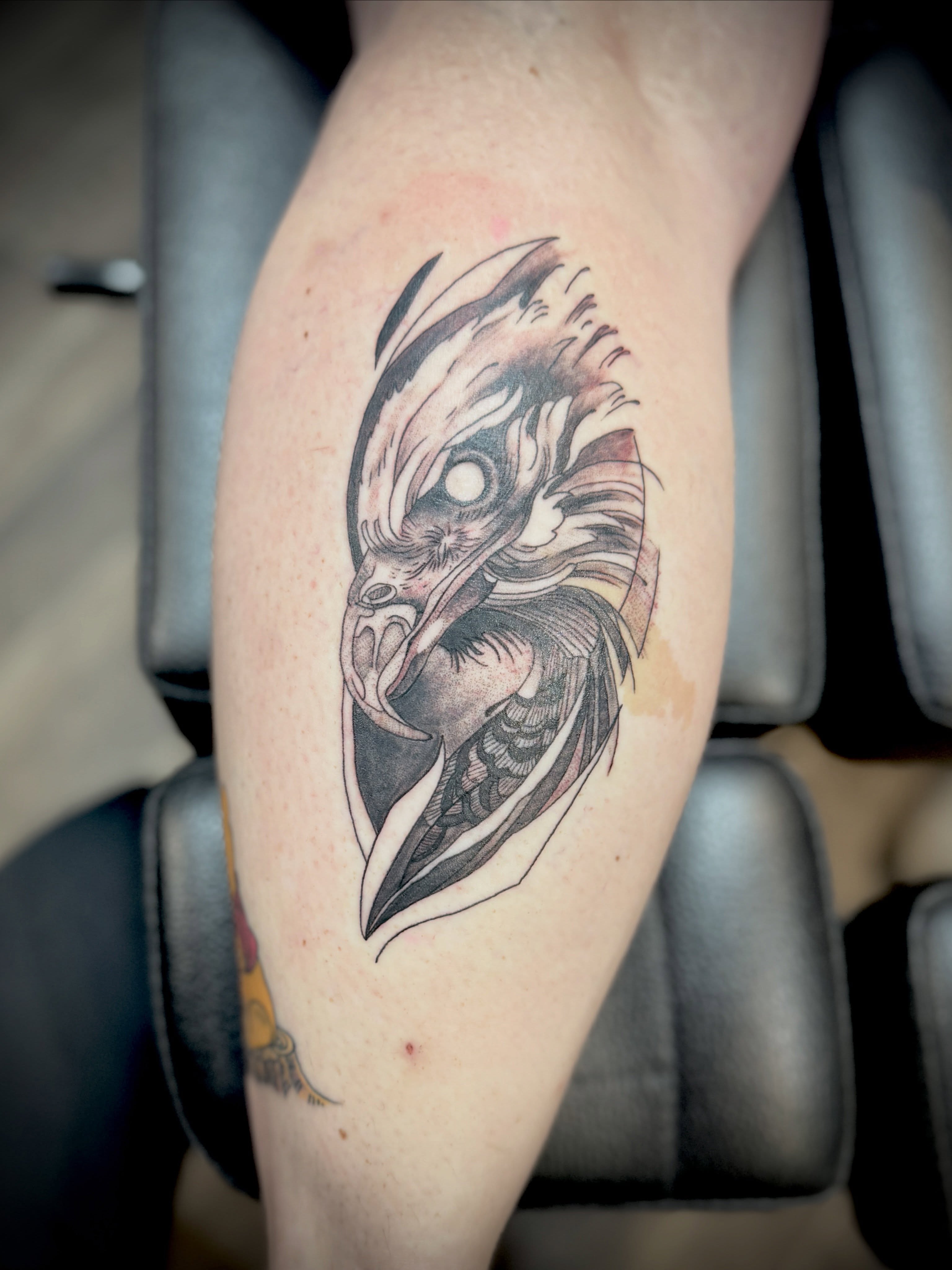 Owl black and grey tattoo on the forearm by Kacy Blalock