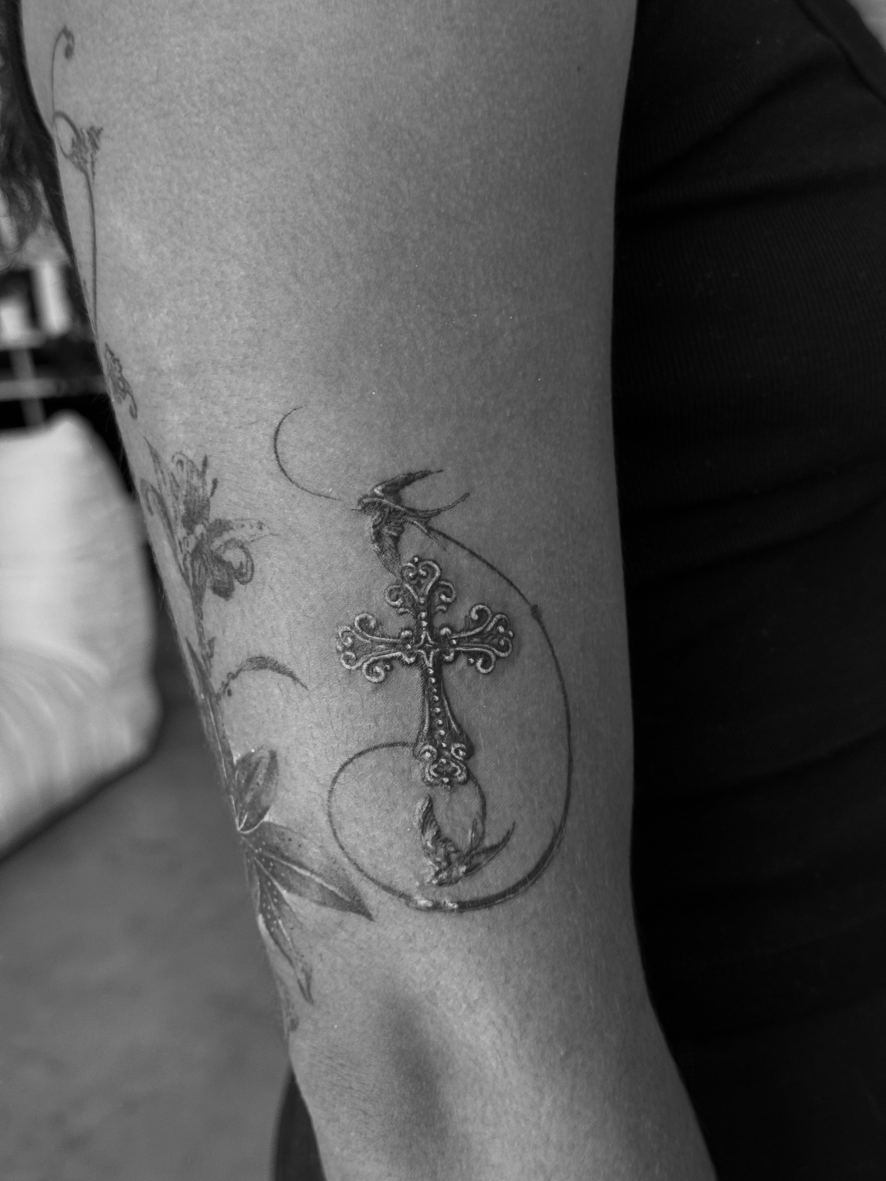 Cross and heart ornamental tattoo on the forearm by Ava De La Torre