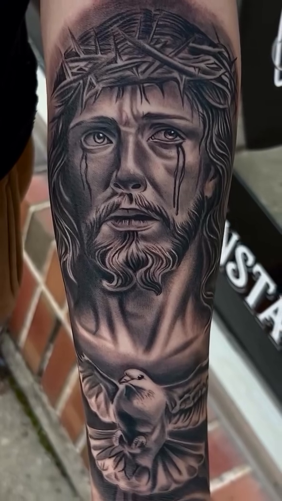 Jesus Christ and a dove realism tattoo by Kevyn Vidal