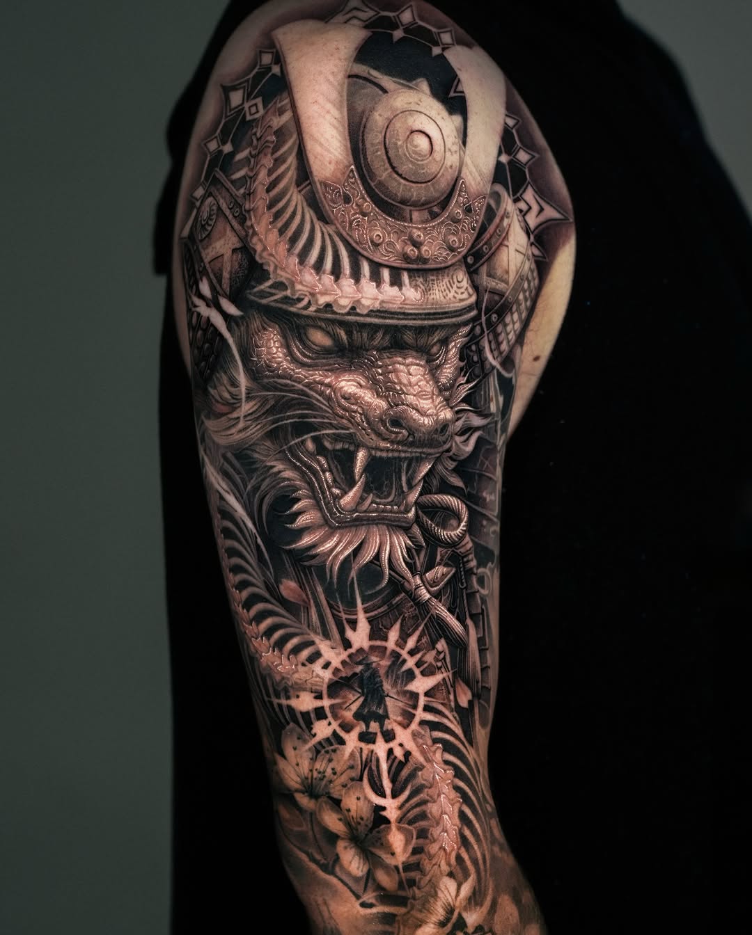 Samurai helmet and dragon Japanese tattoo on the forearm by Sumok Kim