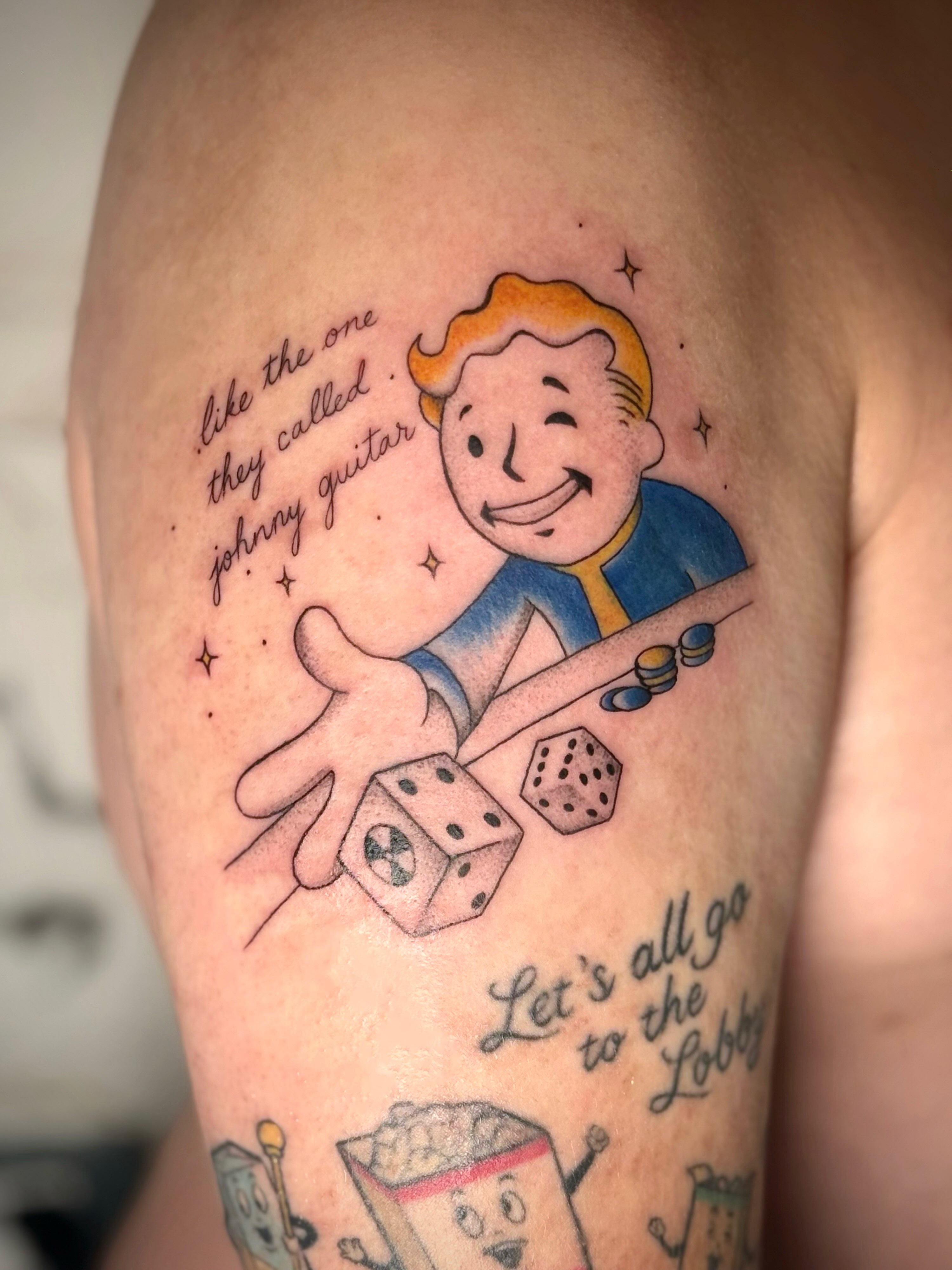 Fallout Vault Boy illustrative tattoo on the upper arm by abbie michelle