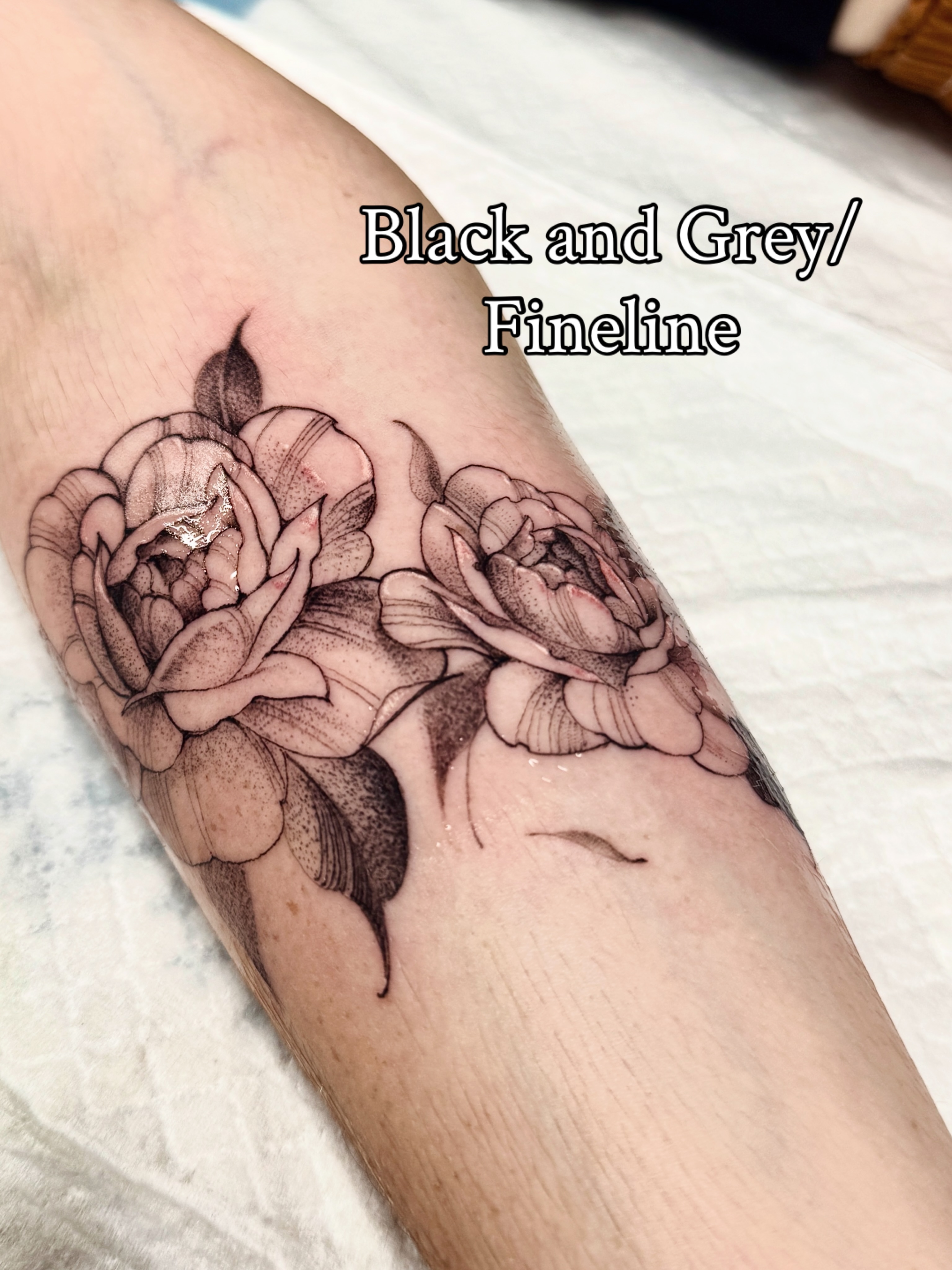 Peony flowers fine line tattoo on the forearm by Andy Rowe- Tattoo Artist🦇