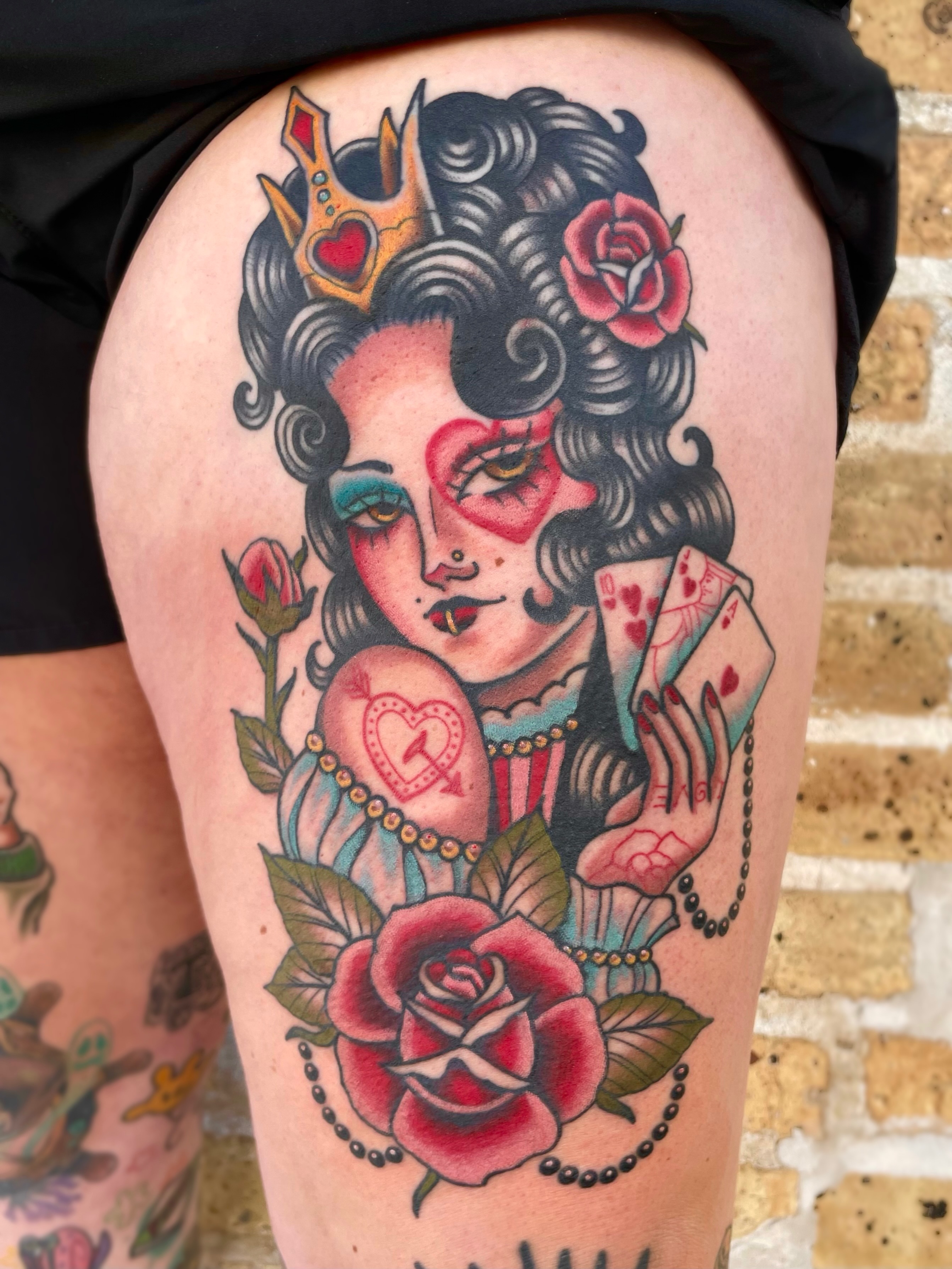 Queen of hearts American traditional tattoo on the thigh by 𝕬𝖓𝖆𝖇𝖊𝖑𝖑 𝕸𝖔𝖗𝖔