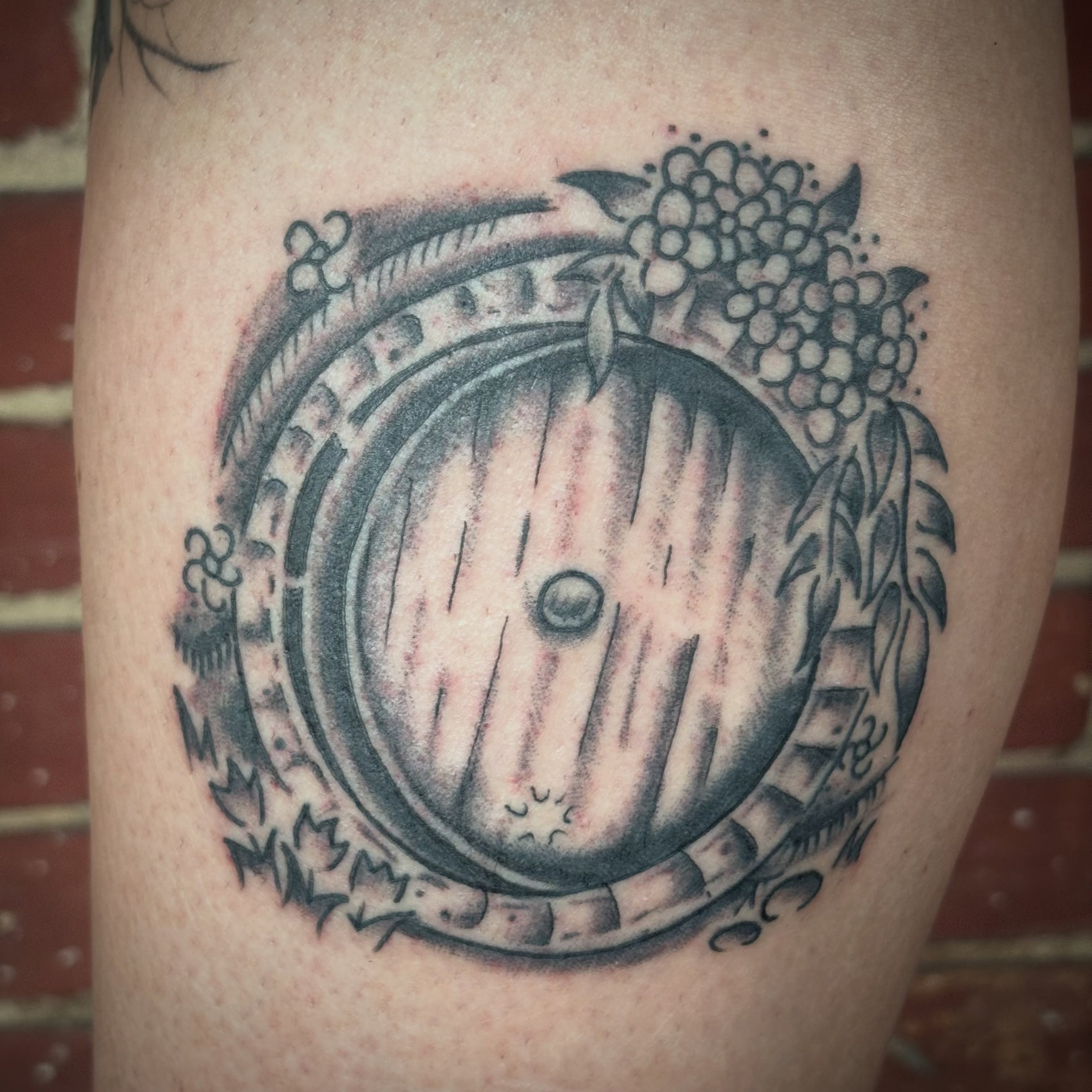 Round door realism tattoo on the thigh by Malachi