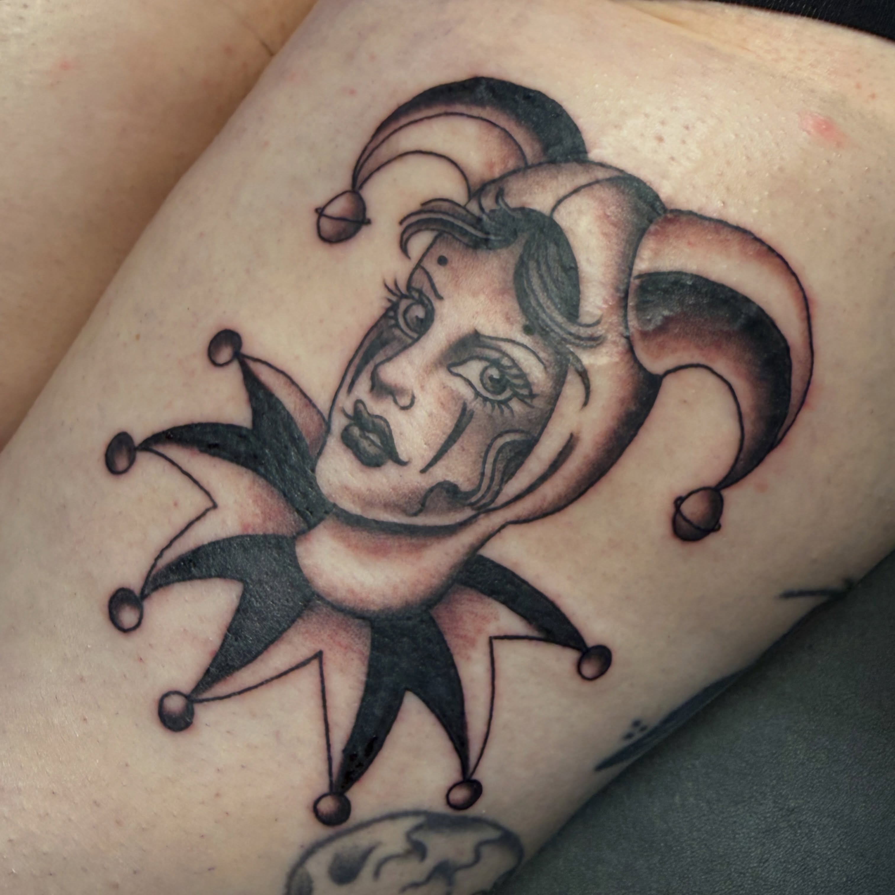 Jester American traditional tattoo on the thigh by Hannah Edwards, Austin, Texas
