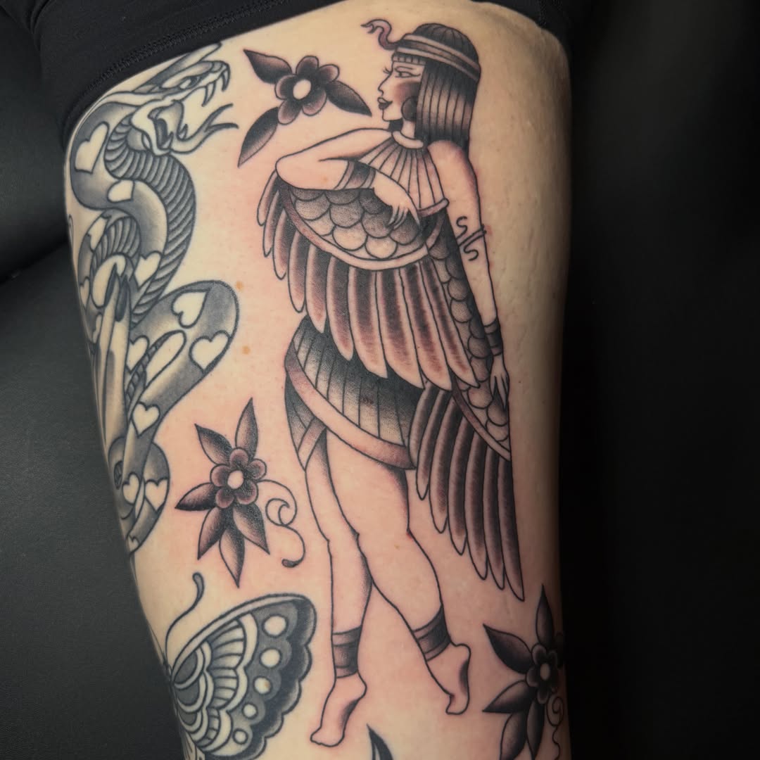 Winged goddess American traditional tattoo on the thigh by Hannah Edwards, Austin, Texas