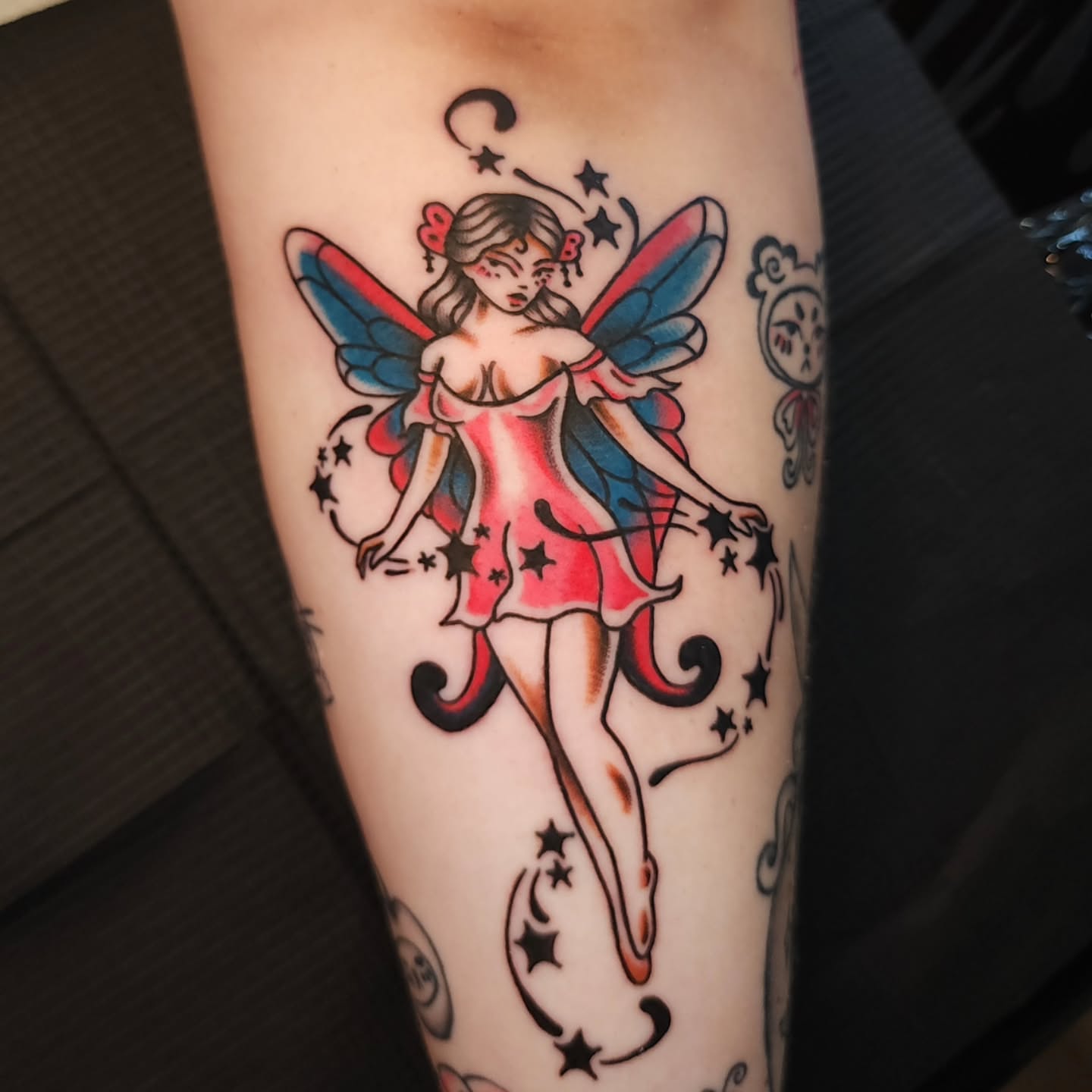 Fairy American traditional tattoo on the forearm by Maxine Stewart