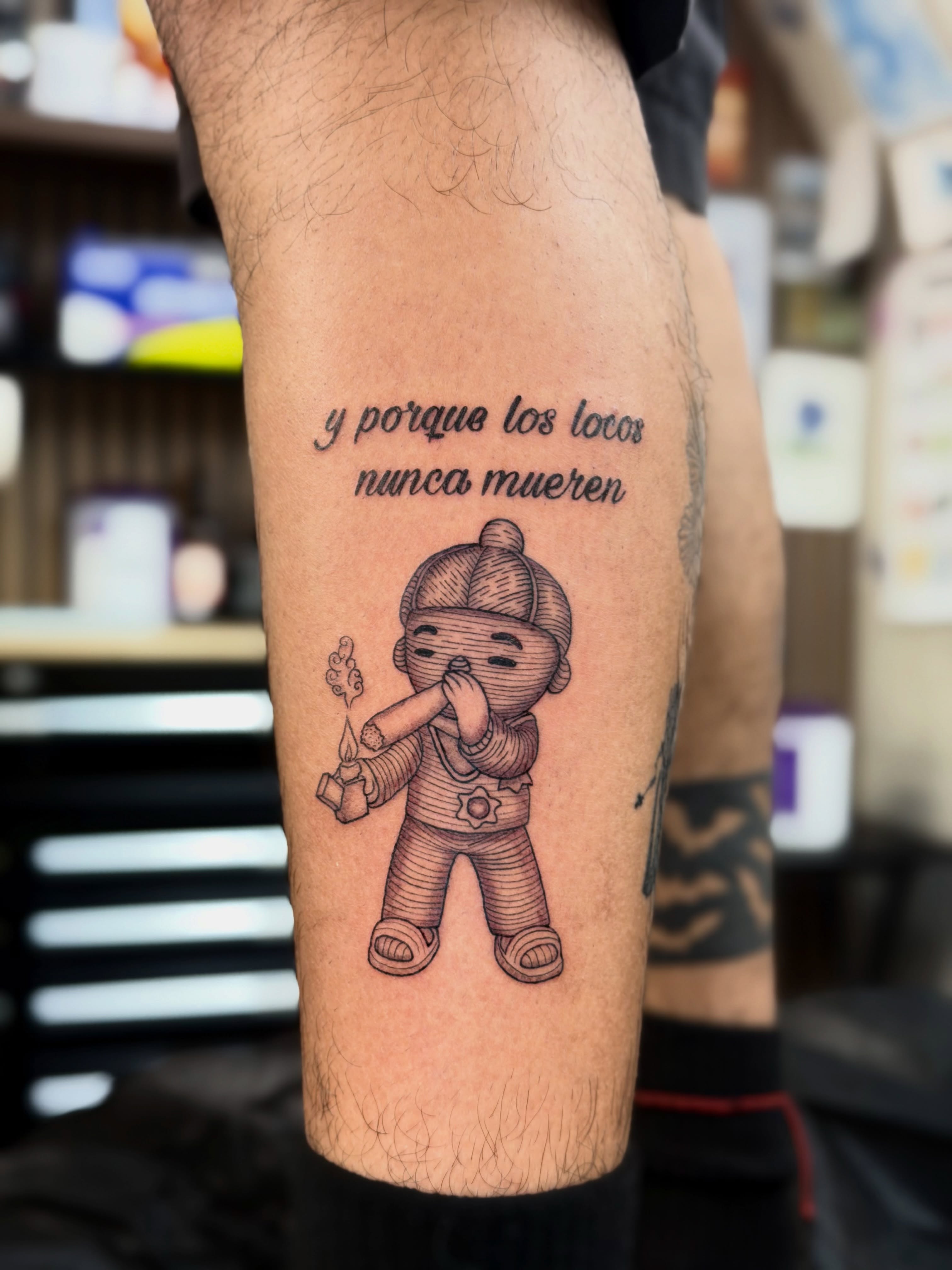 Loco character smoking cigar black and grey tattoo on the forearm by Bryan Nguyen