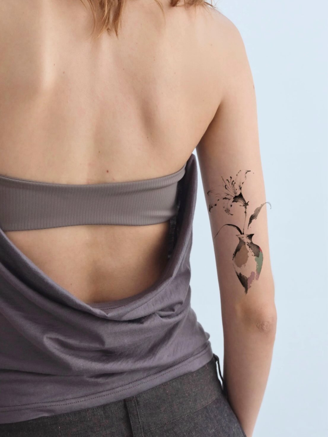 Abstract floral dotwork tattoo on the forearm by Tomato