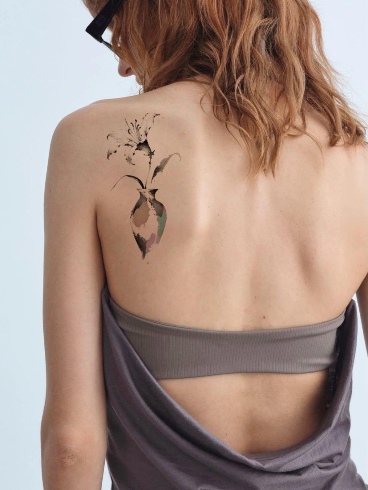 Abstract floral watercolor tattoo on the back by Tomato