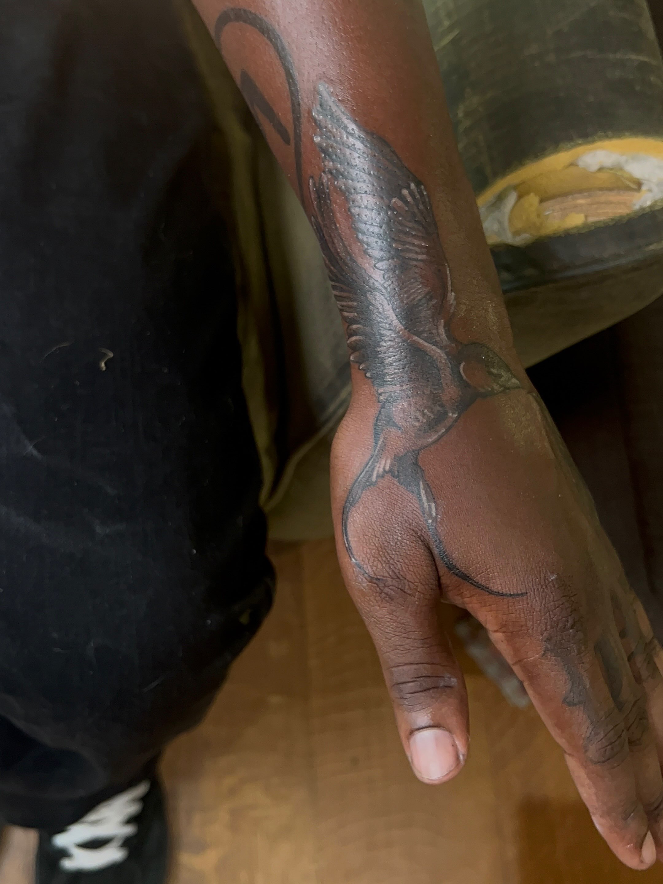 Bird black and grey tattoo on the forearm by zion