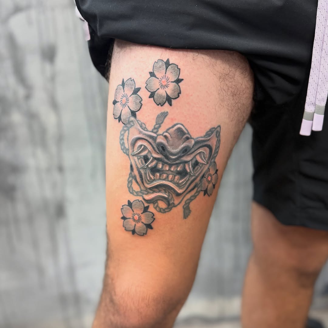 Mask with cherry blossoms japanese irezumi tattoo on the thigh by Camilo
