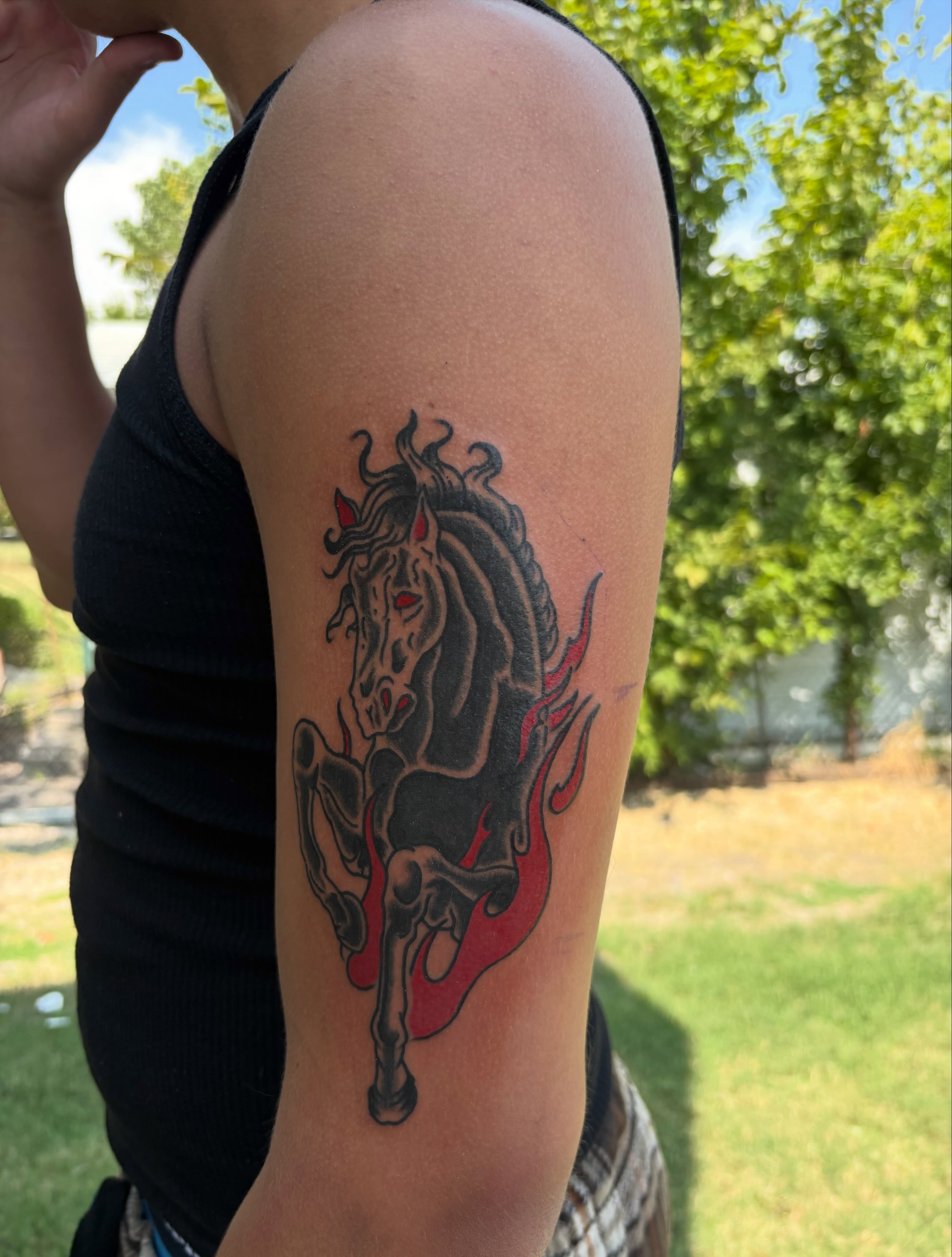 Galloping horse black and grey tattoo on the forearm by Ethan Ellis, Dallas, Texas