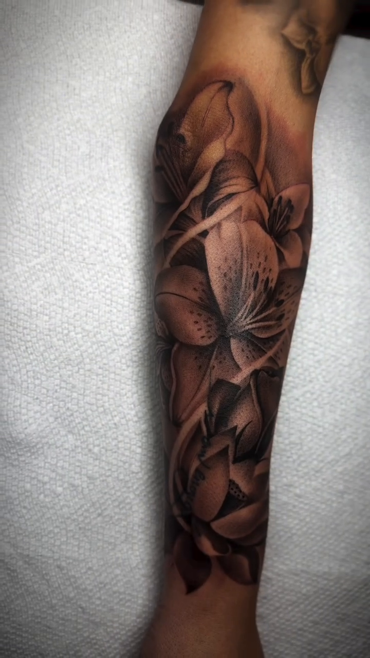 Floral sleeve realism tattoo by Denver Tattoo Artist