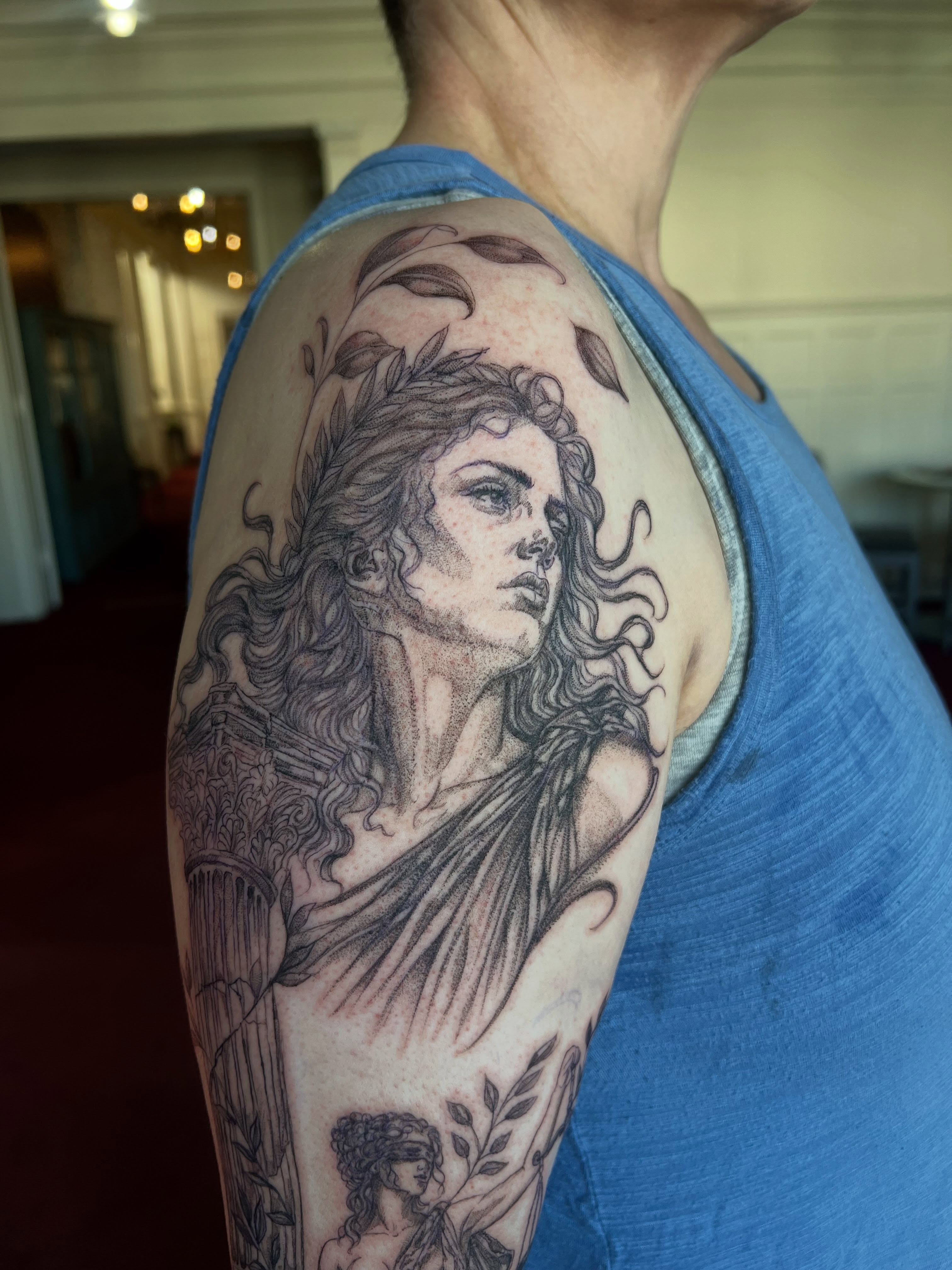 Woman with laurel wreath dotwork tattoo on the shoulder by Jordi WA Tacoma Tattooer