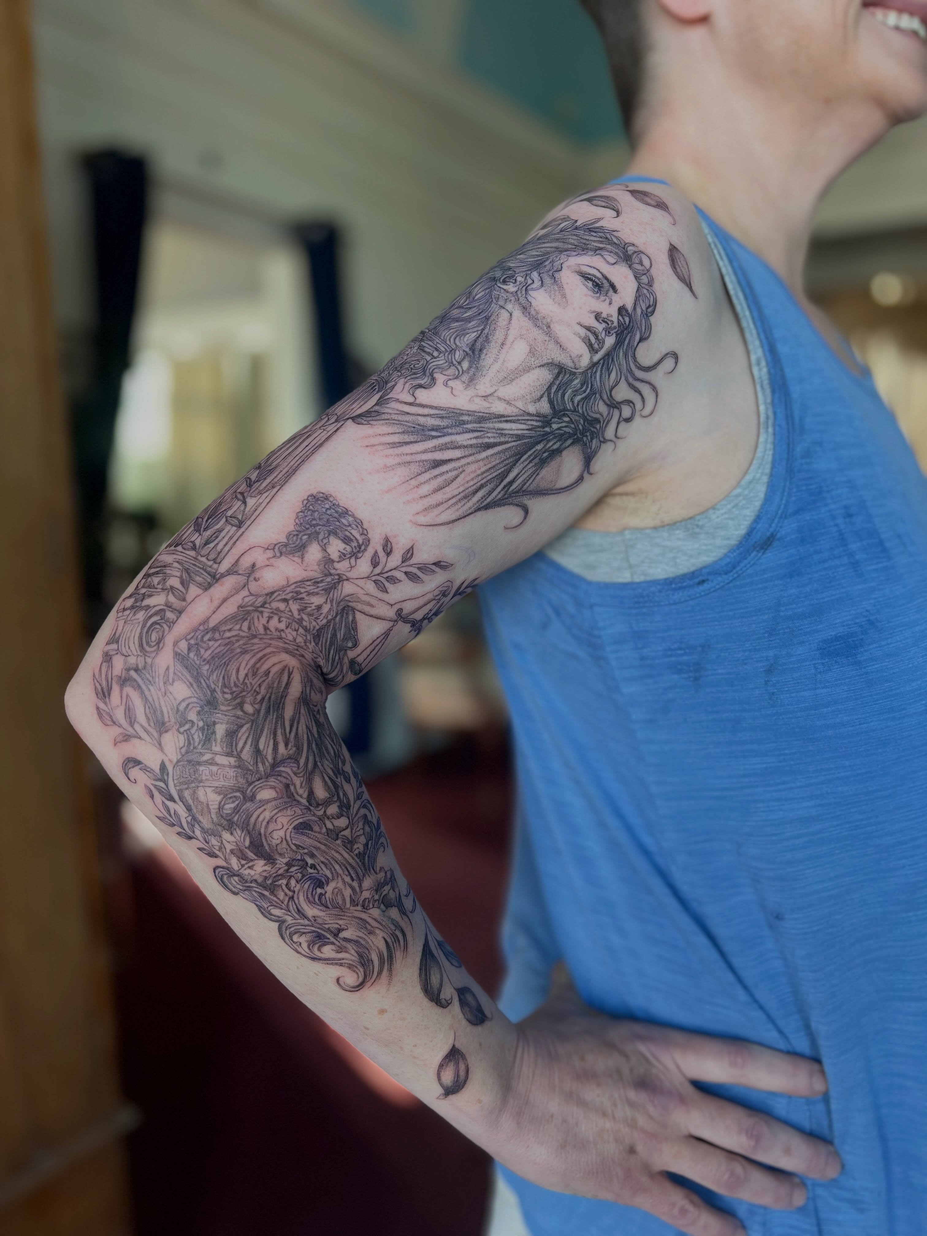 Mythological figure realism tattoo on the upper arm by Jordi WA Tacoma Tattooer