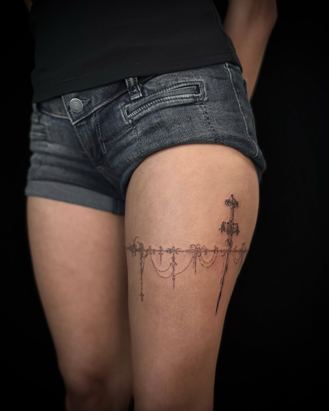 Cross and chandelier black and grey tattoo on the thigh by alyssa ⋆₊ ♱