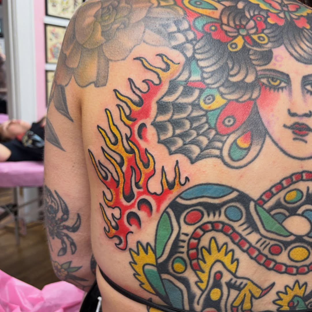 Flame and woman's face American traditional tattoo on the shoulder by Mr. Brent