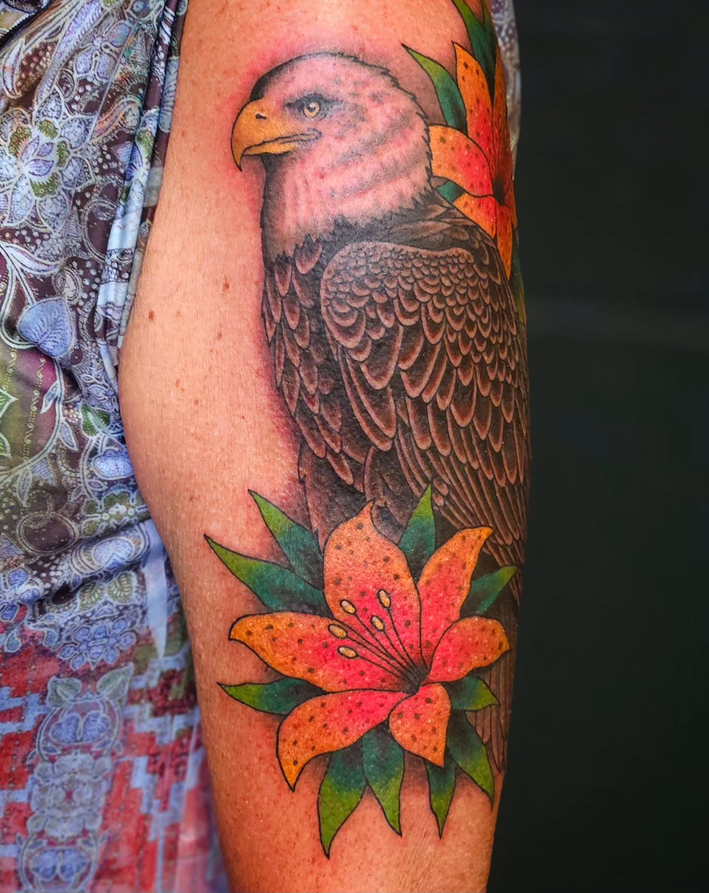 Eagle and lily realism tattoo on the forearm by Mike Graske, Minneapolis, Minnesota