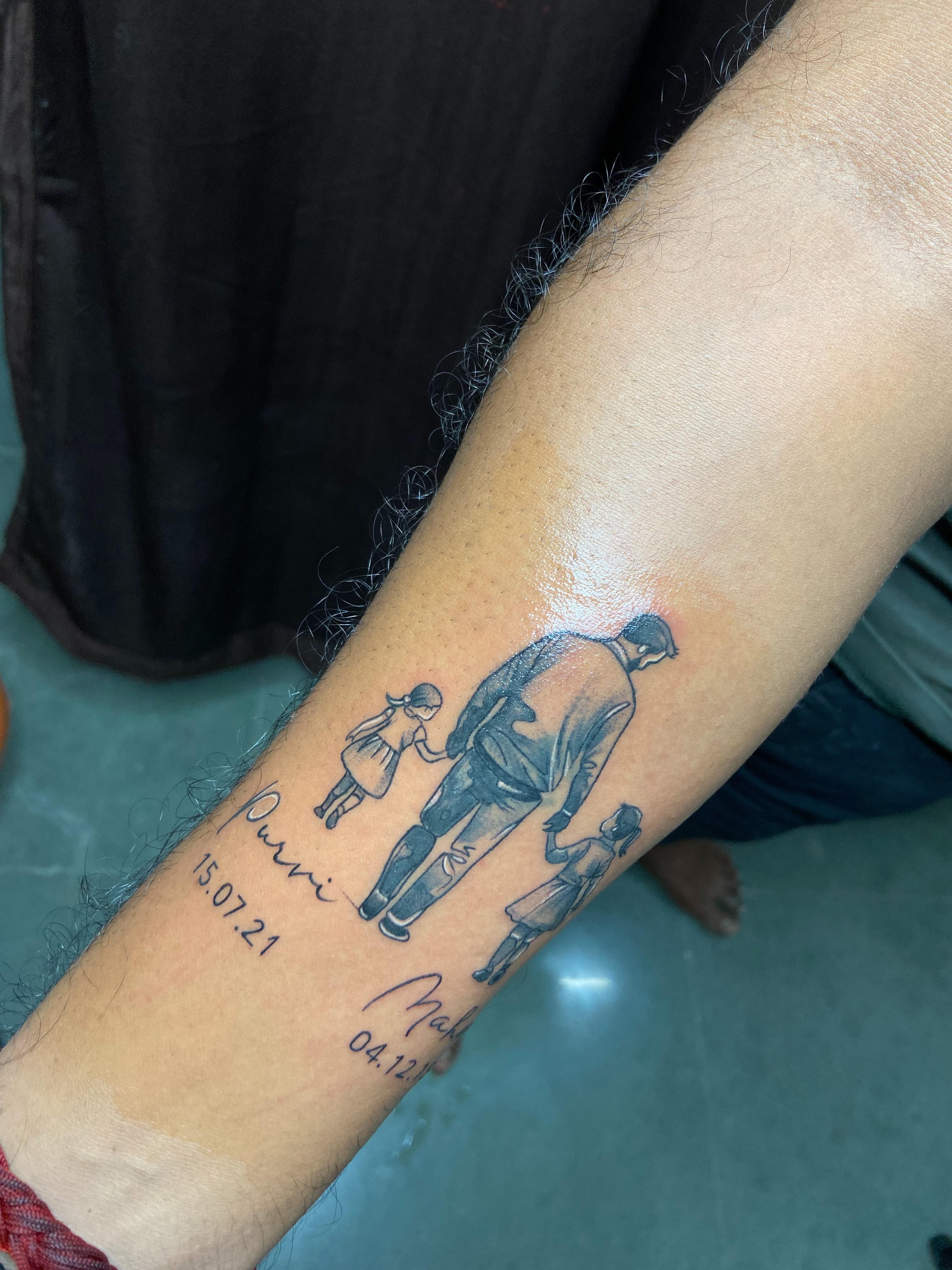 Family scene black and grey tattoo on the forearm by VR tattoo Studio