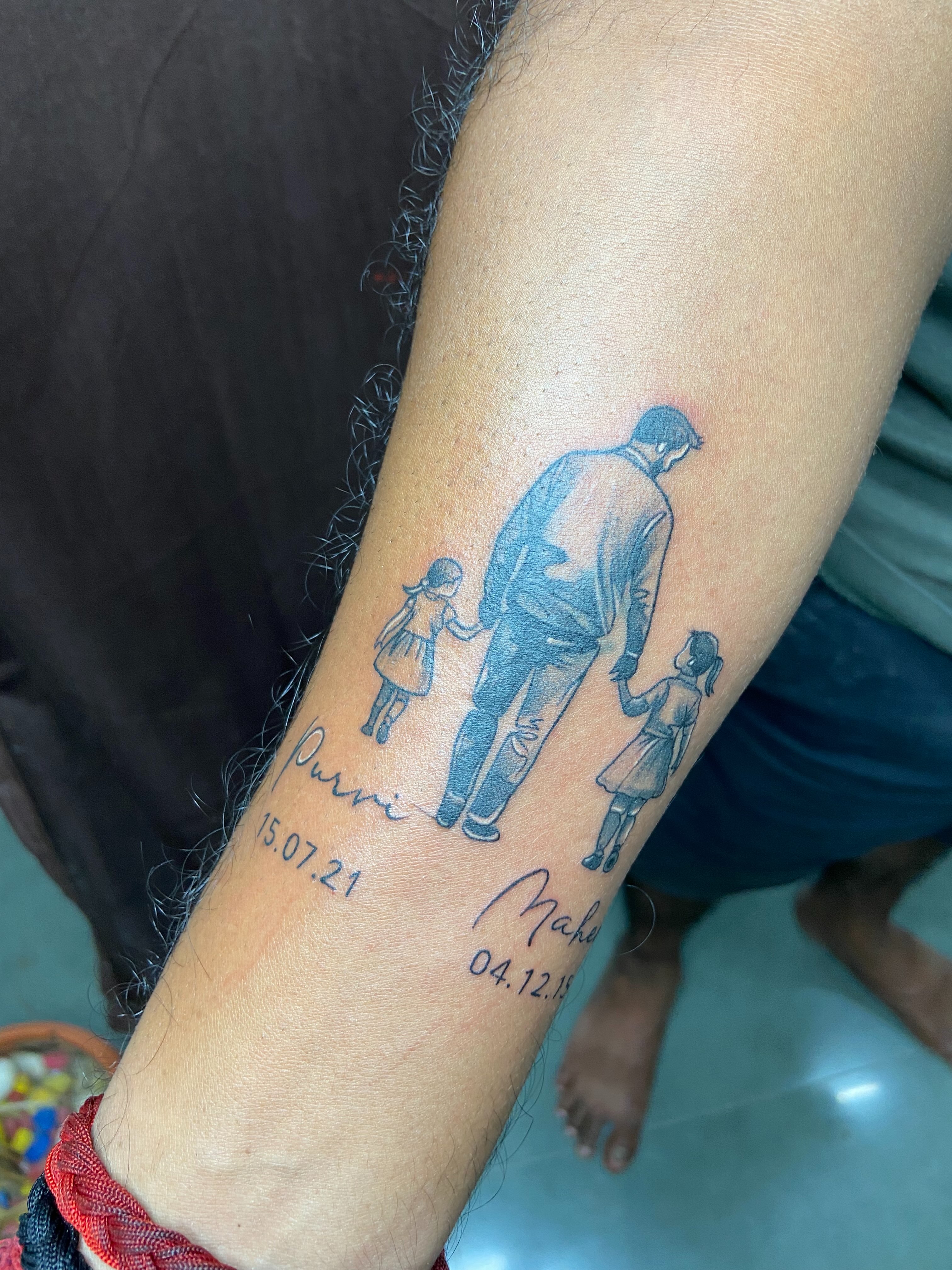 Family black and grey tattoo on the forearm by VR tattoo Studio