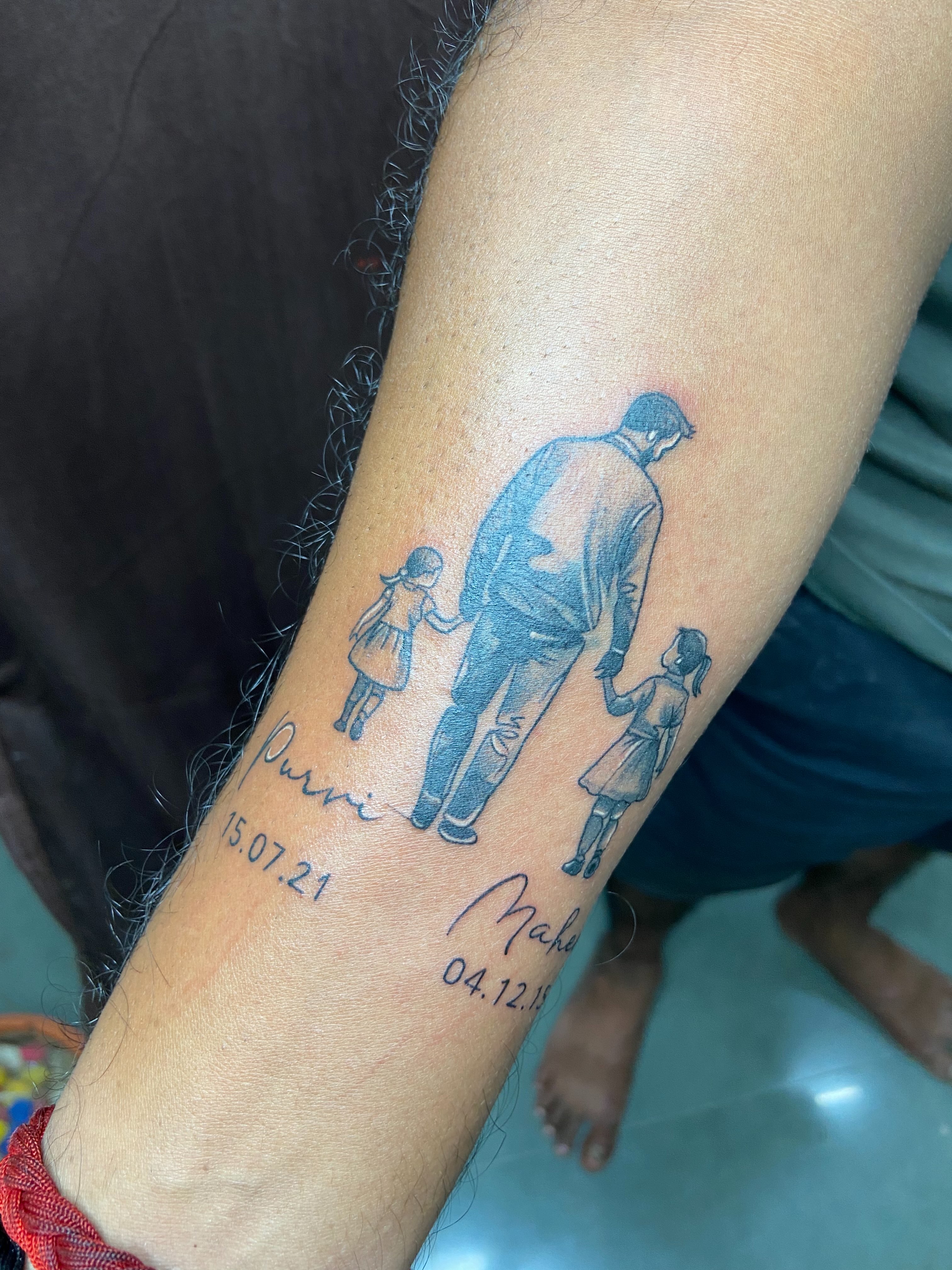 Father and two daughters black and grey tattoo on the forearm by VR tattoo Studio