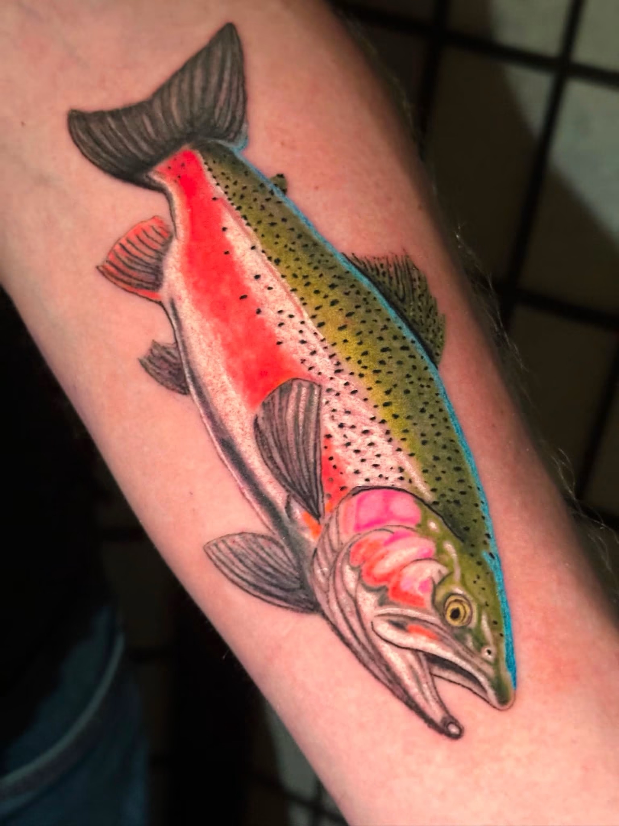 Rainbow trout realism tattoo on the forearm by Chris Whittaker Tattoo Artist