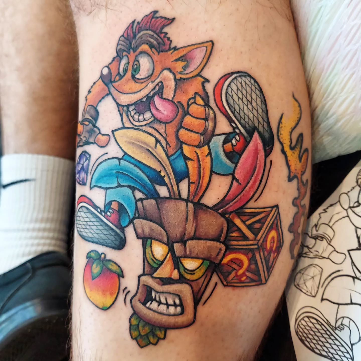 Crash bandicoot new school tattoo on the forearm by Kari Rhoades, Marion, Iowa