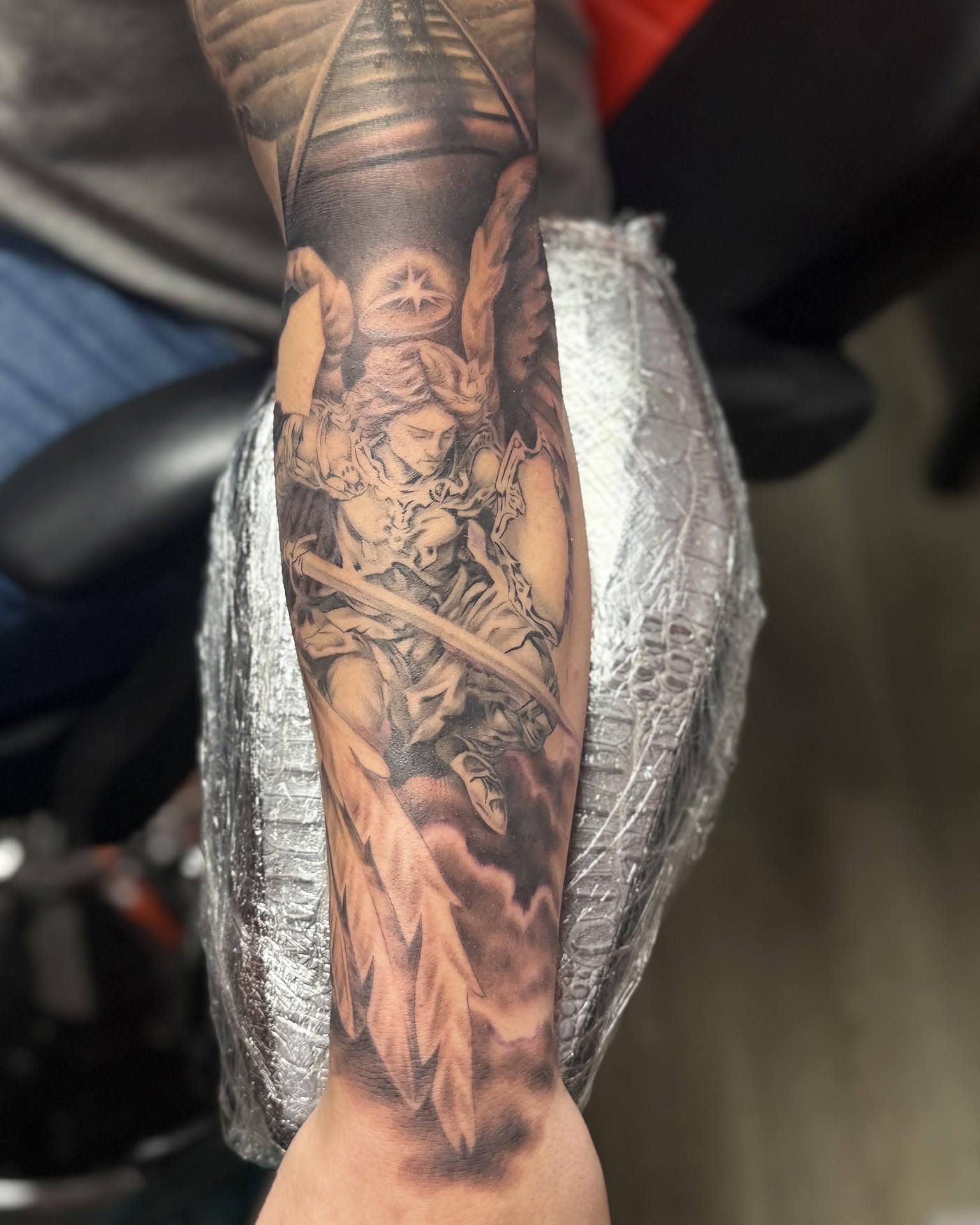 Angelic warrior realism tattoo on the forearm by Gene Britton