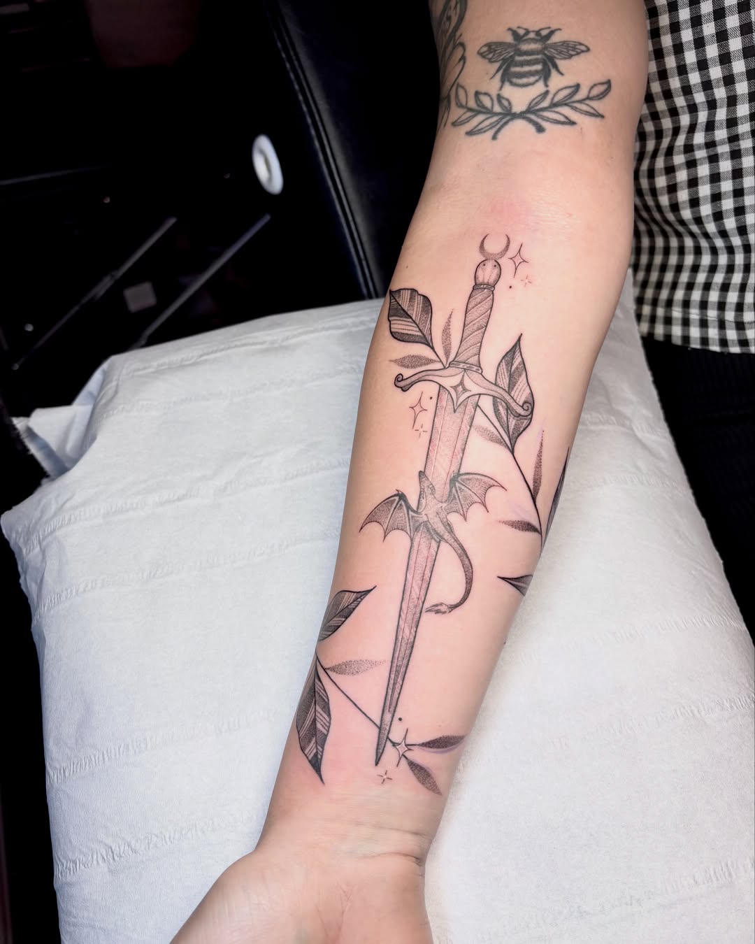 Sword and dragon black and grey tattoo on the forearm by Charlotte Brown, Leeds, England