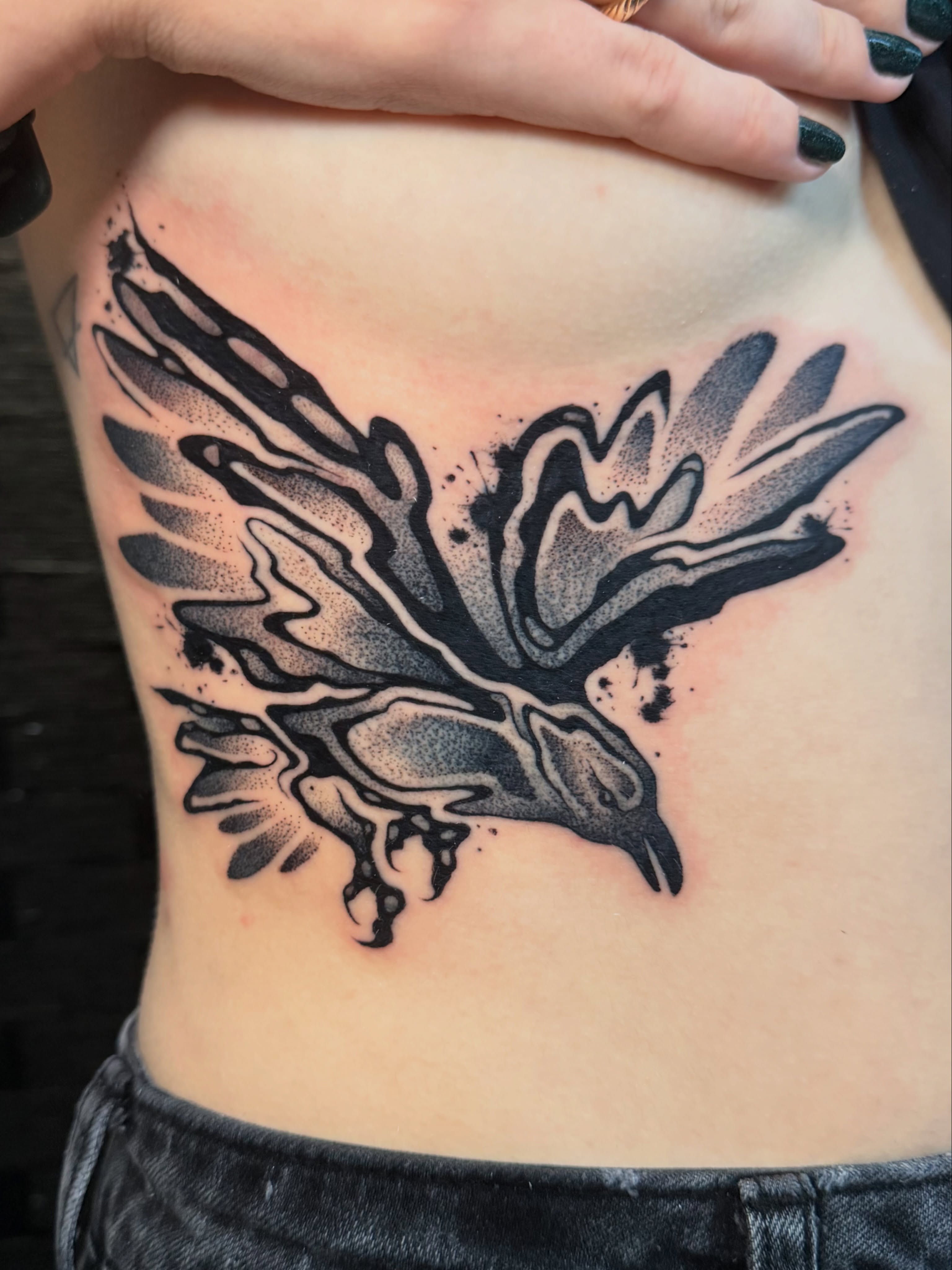 Bird dotwork tattoo on the ribs by Sam Castro