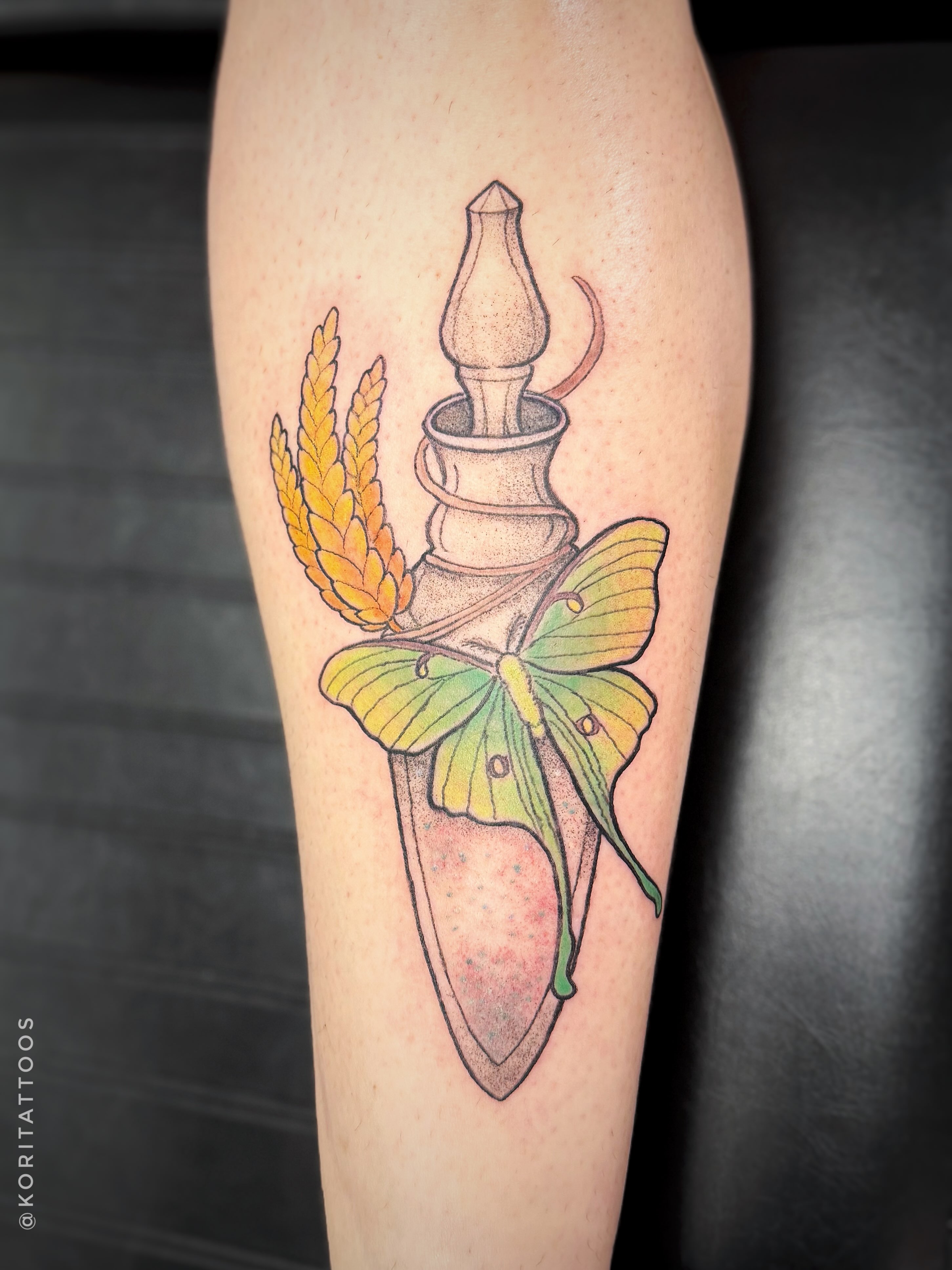 Butterfly and candle new school tattoo on the forearm by Kori Millhimes