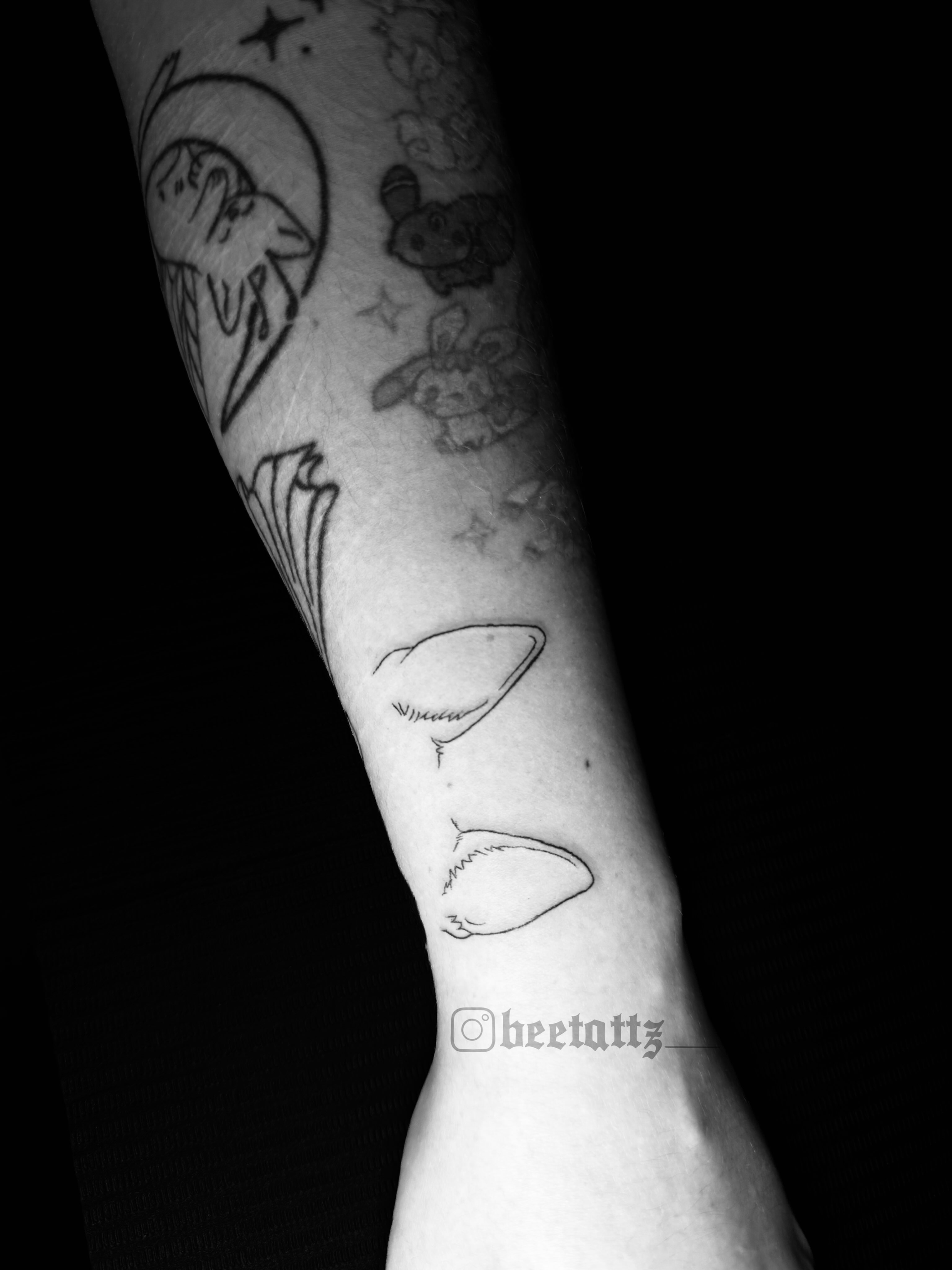 Pokemon characters black and grey tattoo on the forearm by Brinkley McGill