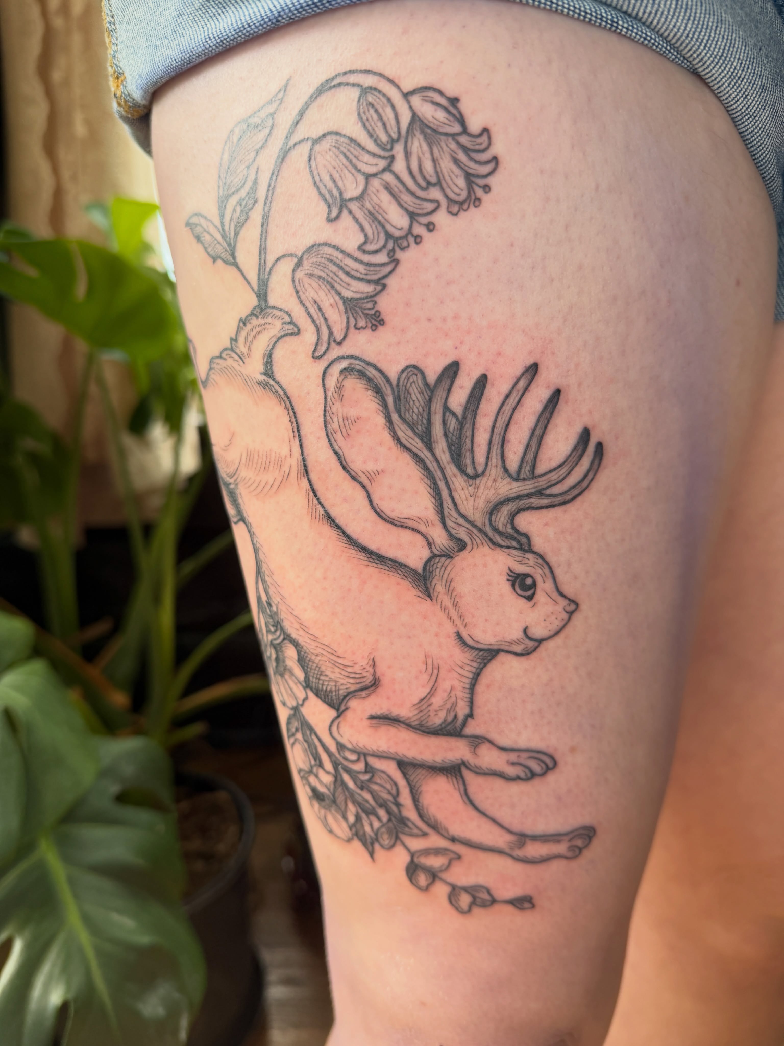 Rabbit with antlers realism tattoo on the thigh by Lora Bird