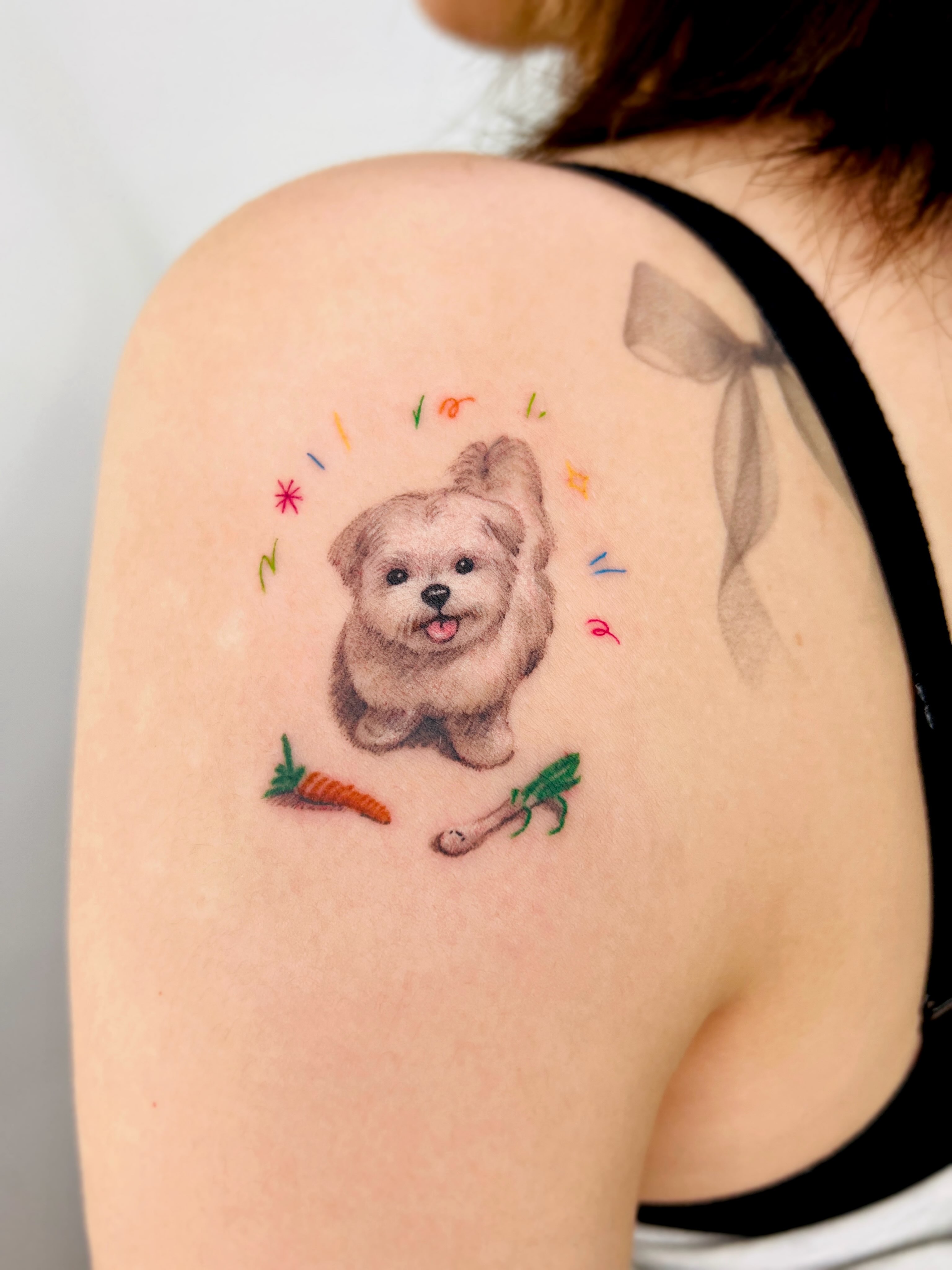 Dog watercolor tattoo on the shoulder by Purinn