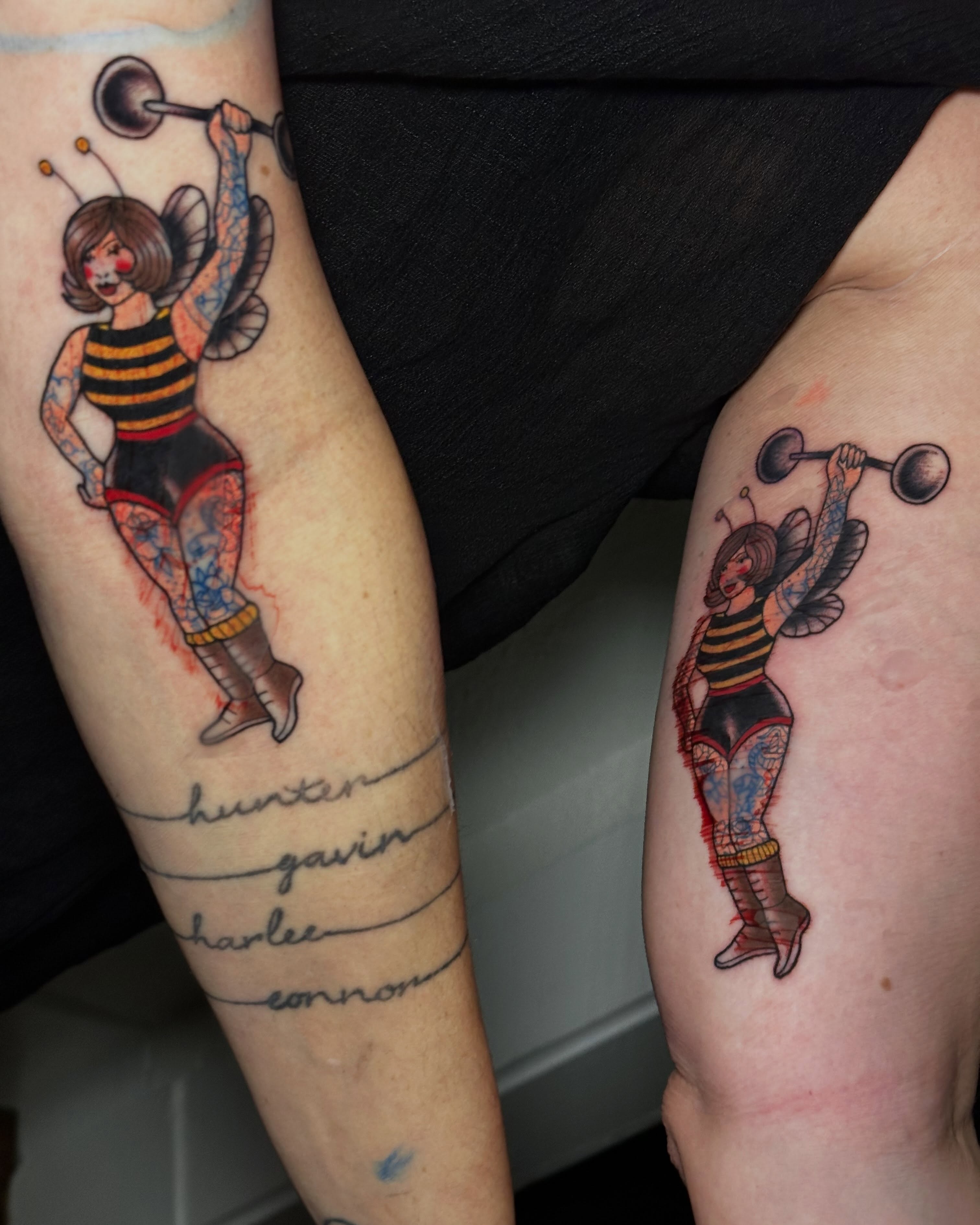 Bee woman lifting weights American traditional tattoo on the upper arm by Liz McDonald