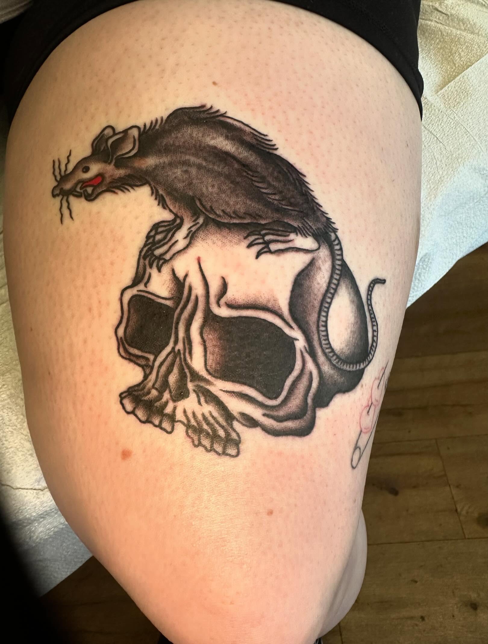 Rat and skull black and grey tattoo on the thigh by Kaylee Woods