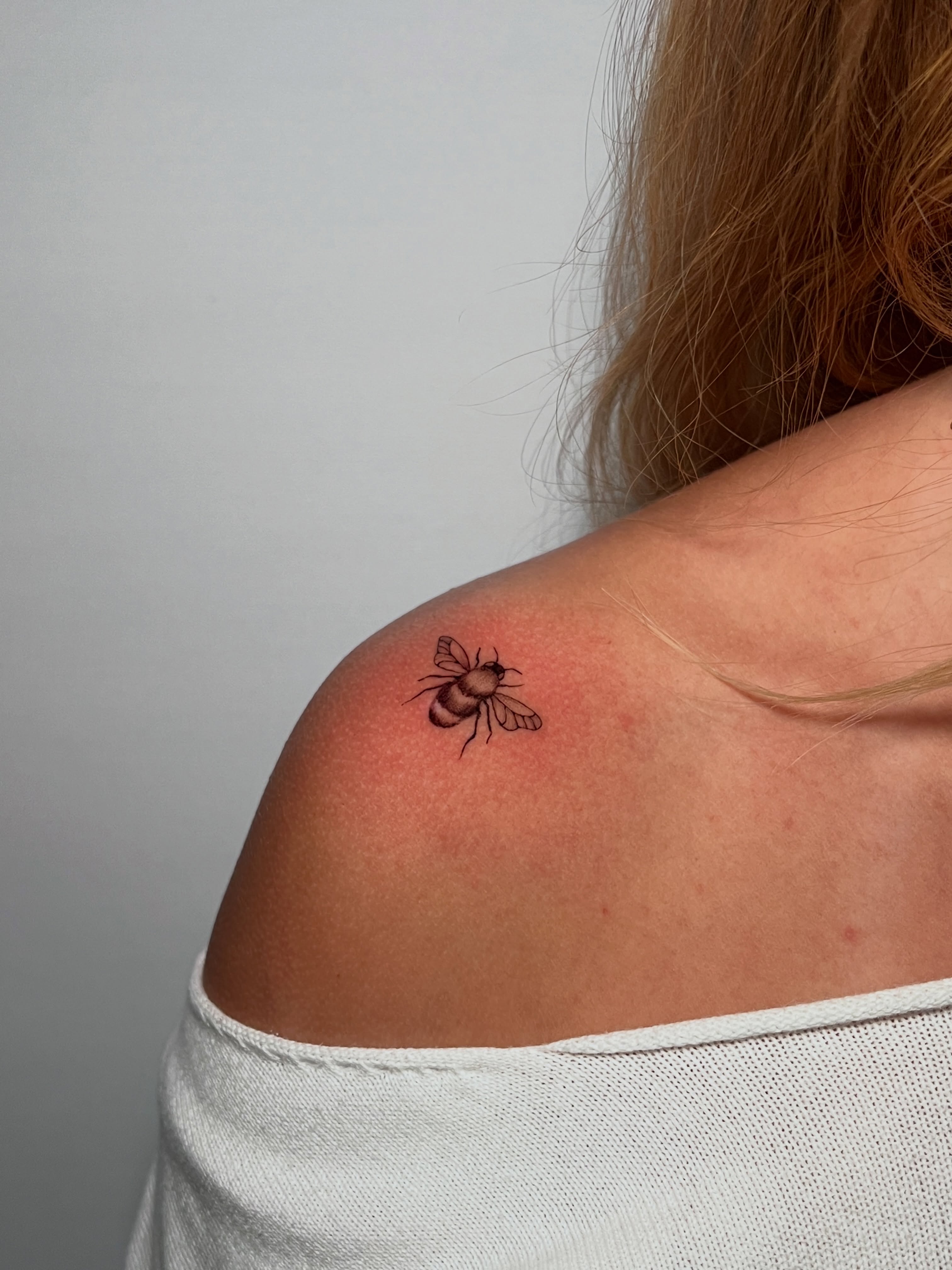 Bee realism tattoo on the shoulder by Eleana, North Miami, Florida