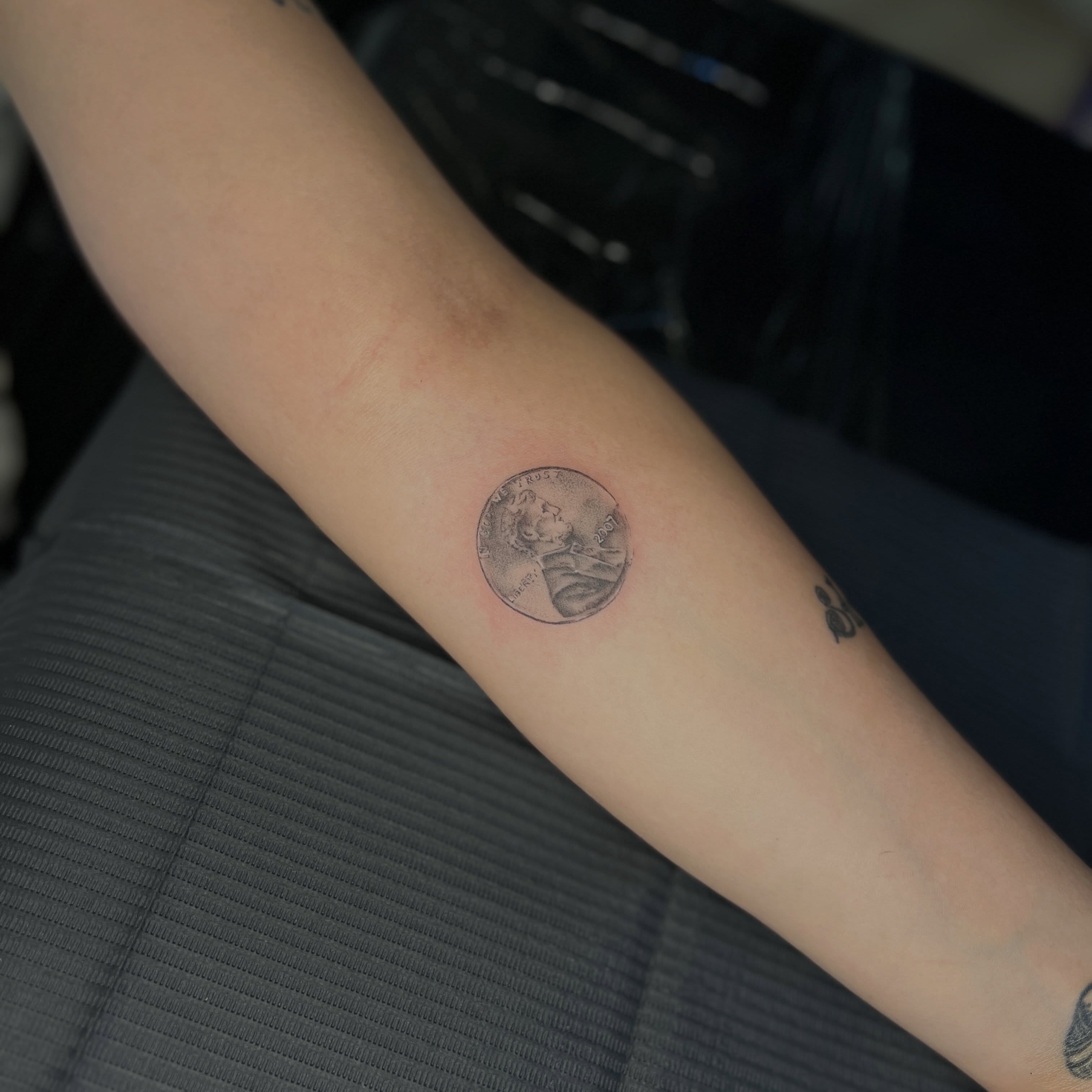 Coin black and grey tattoo on the forearm by Kait