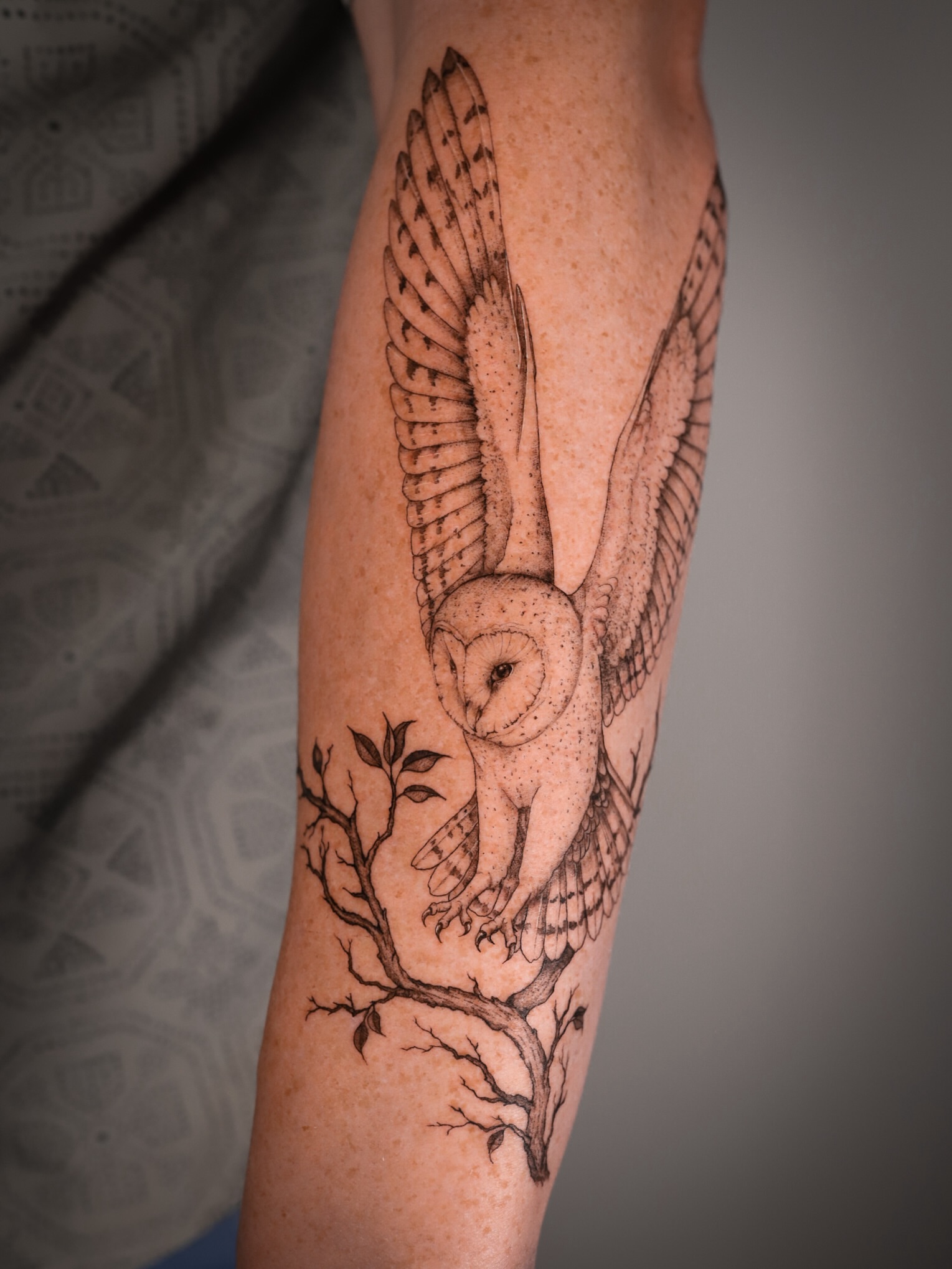 Owl perched on branch dotwork tattoo on the forearm by Caroline + Utah Tattoo Artist