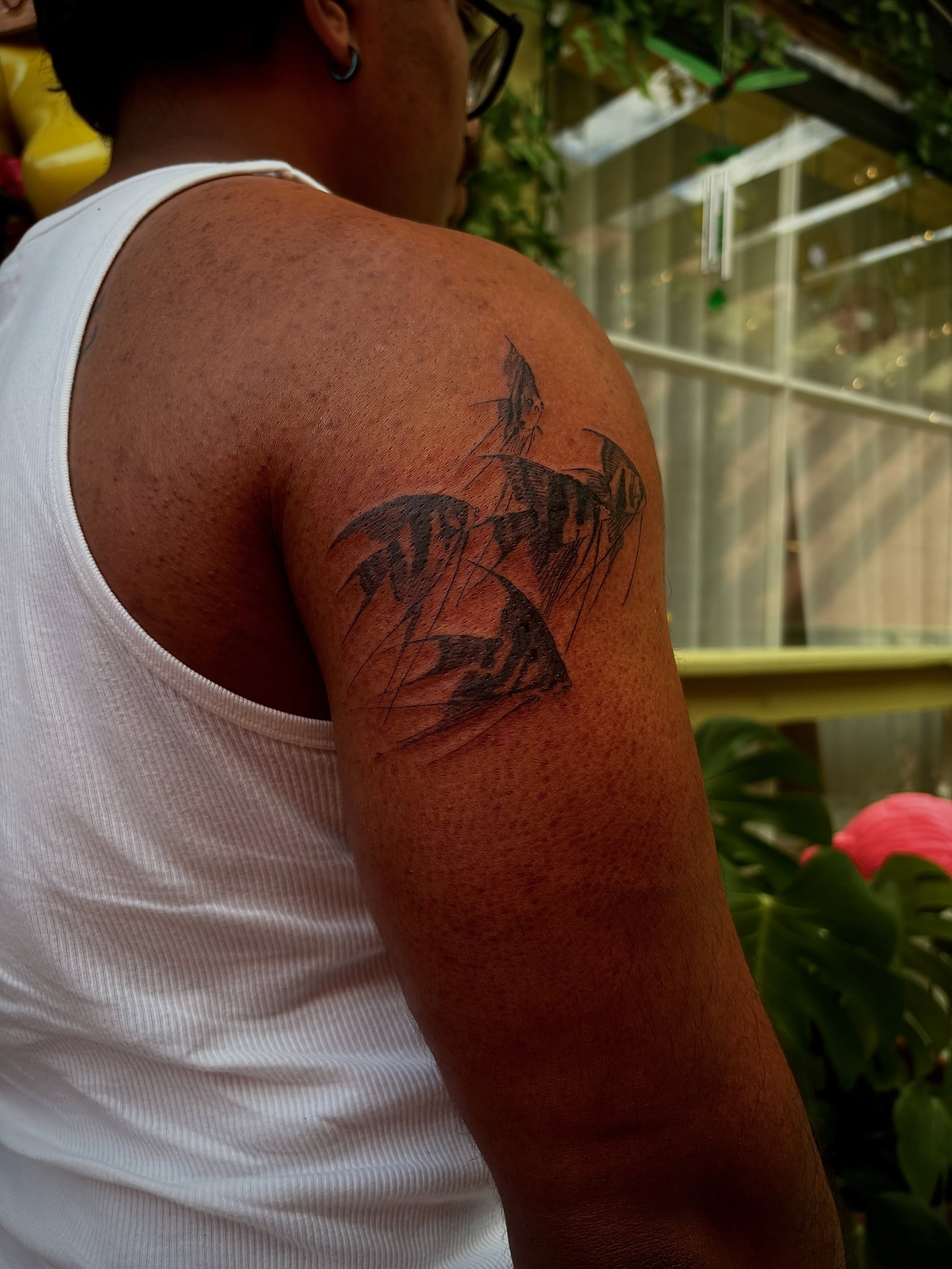 Angelfish black and grey tattoo on the shoulder by @tattotos