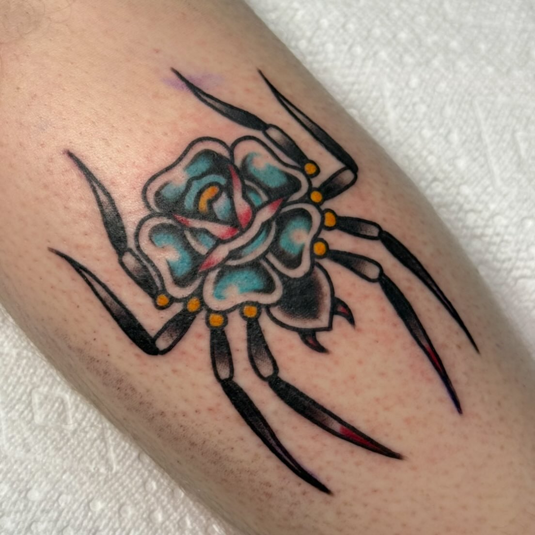 Spider and flower American traditional tattoo on the forearm by ✮KAT✮