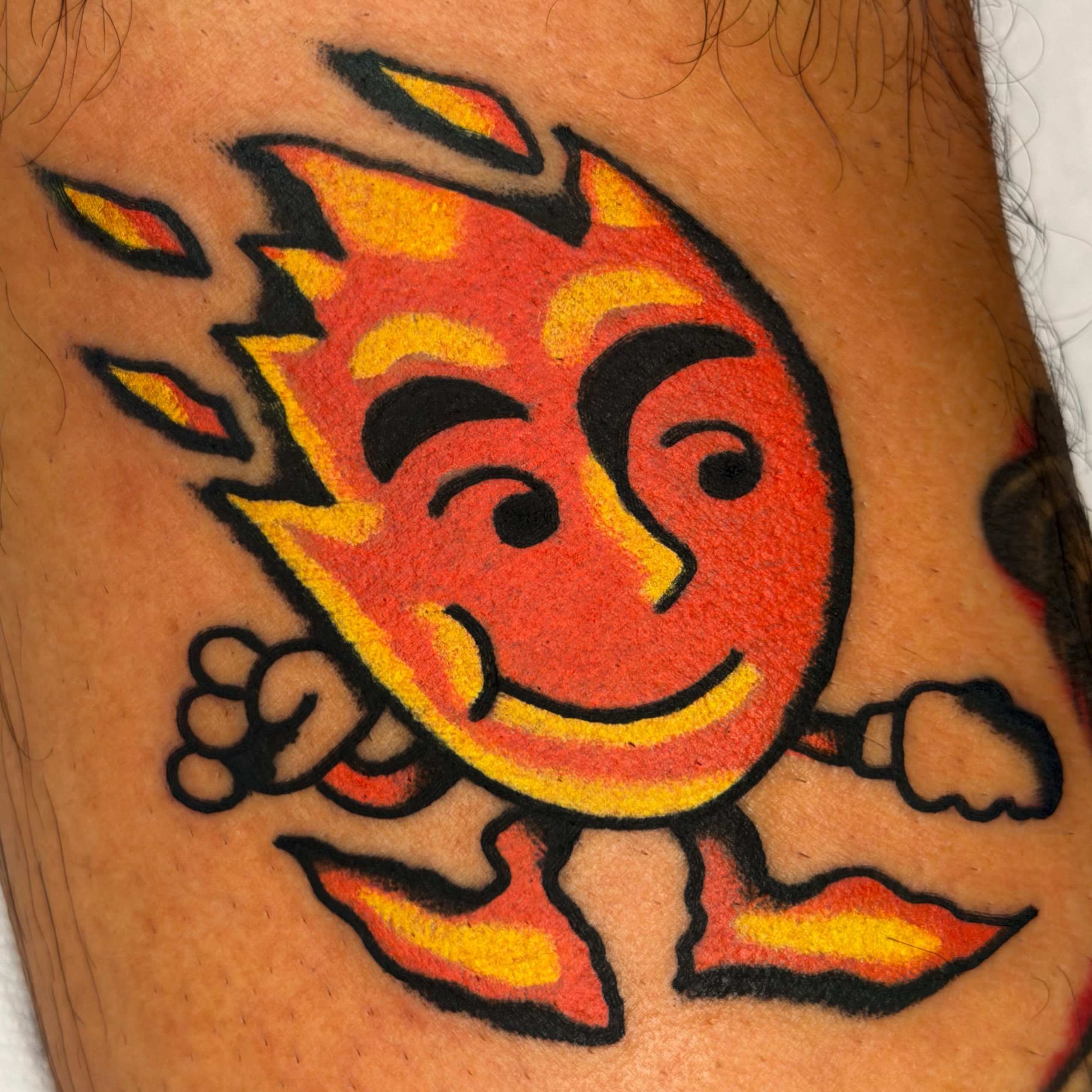 Flaming sun American traditional tattoo on the forearm by Jake