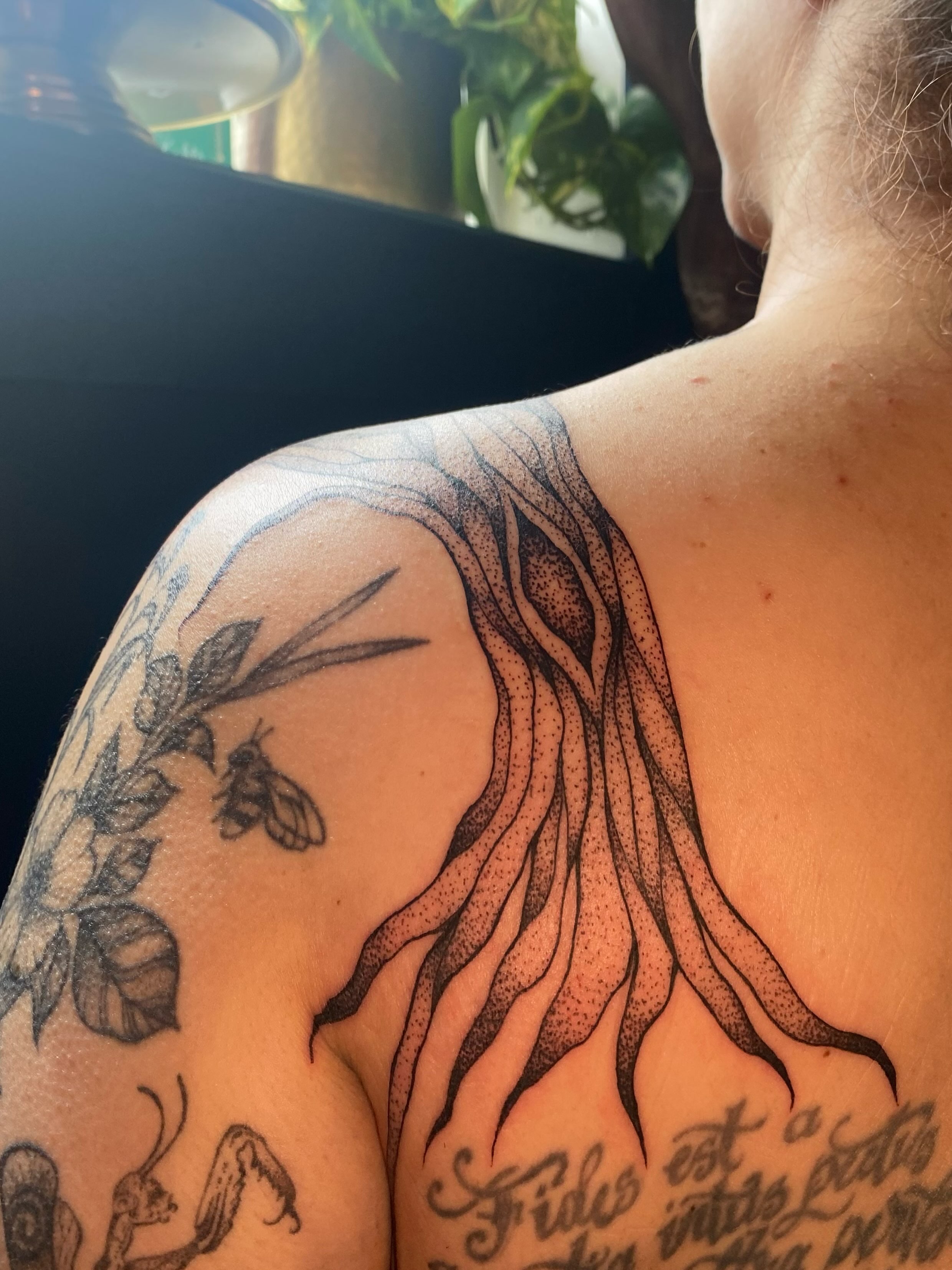 Tree roots dotwork tattoo on the shoulder by Jesikah Rapp