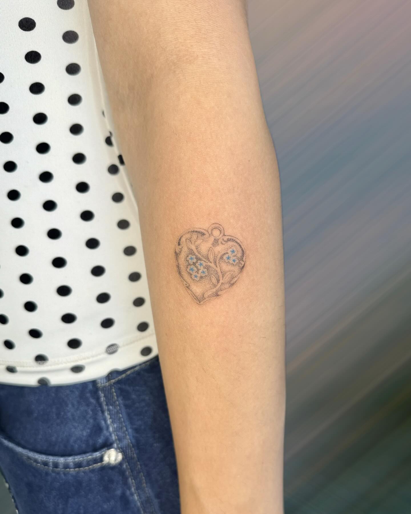 Heart with floral design black and grey tattoo on the forearm by GG ๐ธ