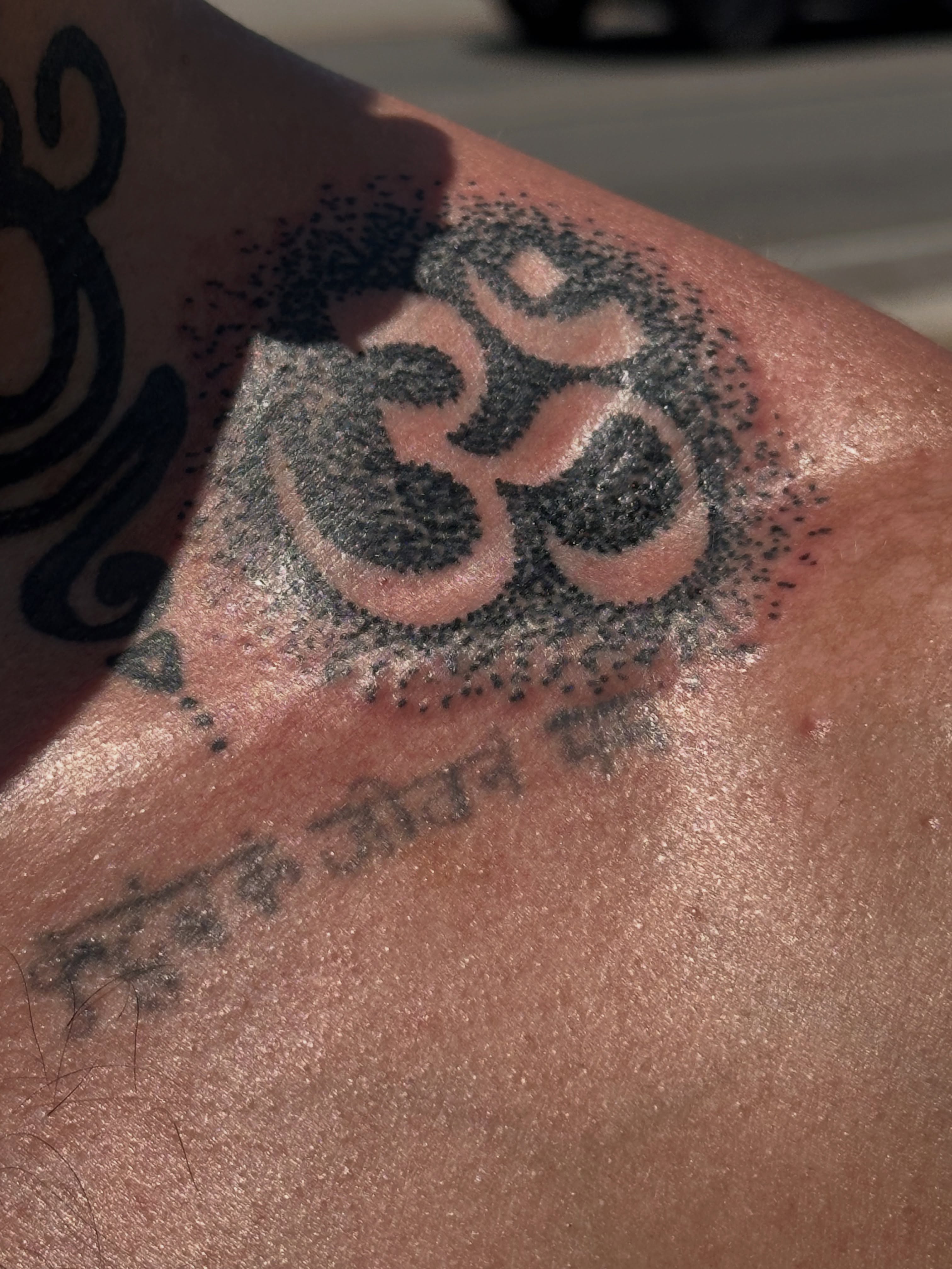 Om symbol dotwork tattoo on the shoulder by Gabriel F Kingston Beitia