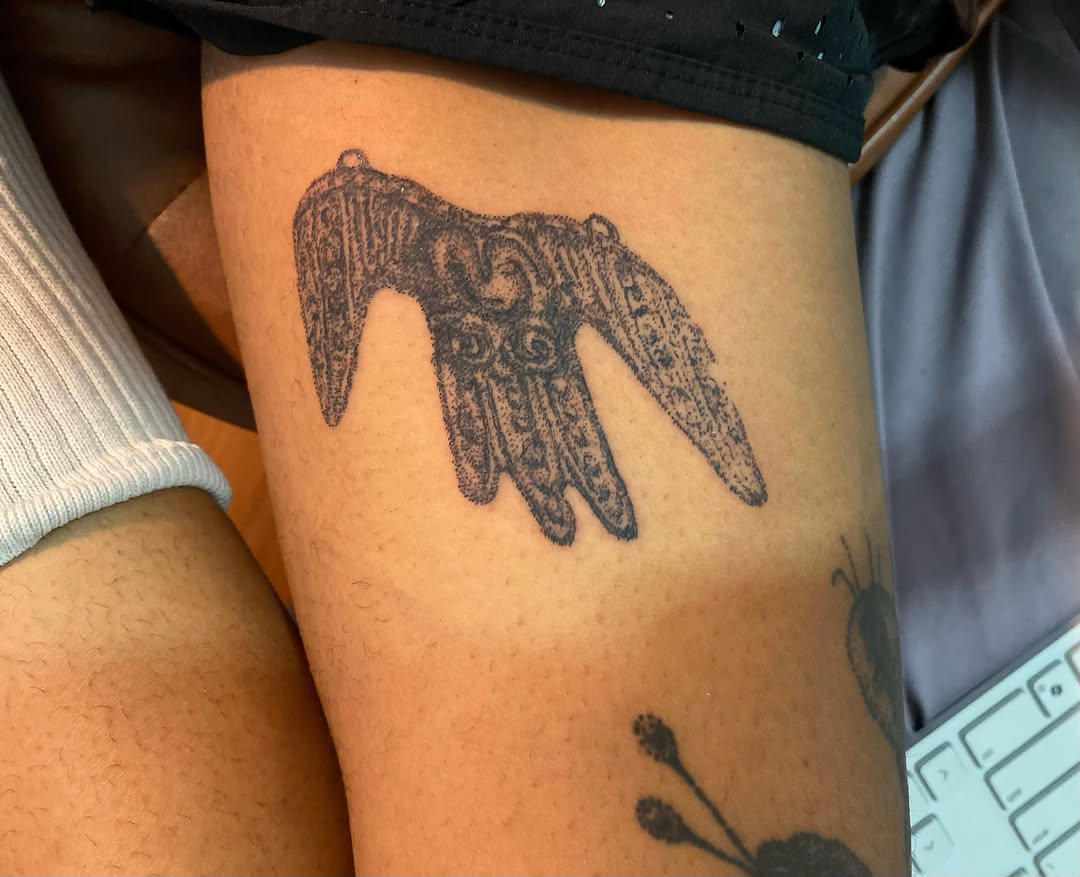 Hamsa hand fine line tattoo on the thigh by @feverfeverish