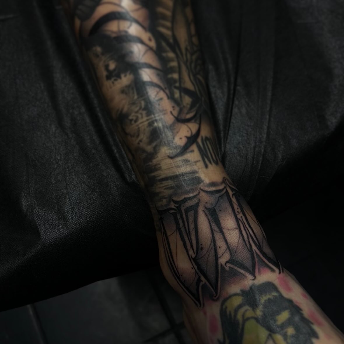 Bat wings geometric tattoo on the forearm by suzie